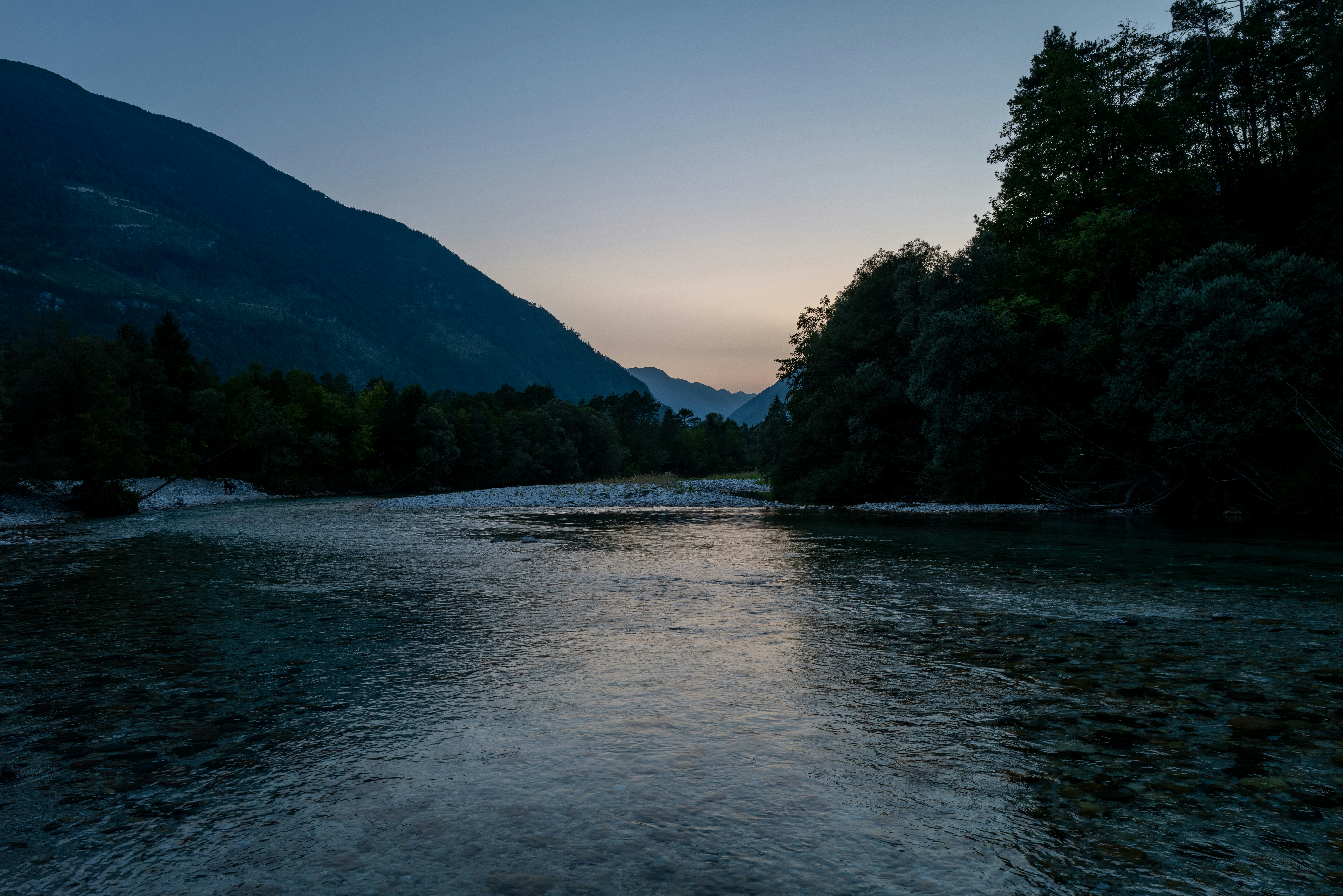 River flowing between dark forested banks - Free Photo on Unsplash
