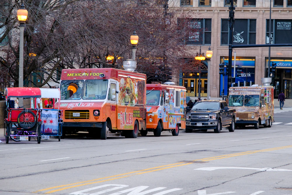 Colorful food trucks parked on a city street