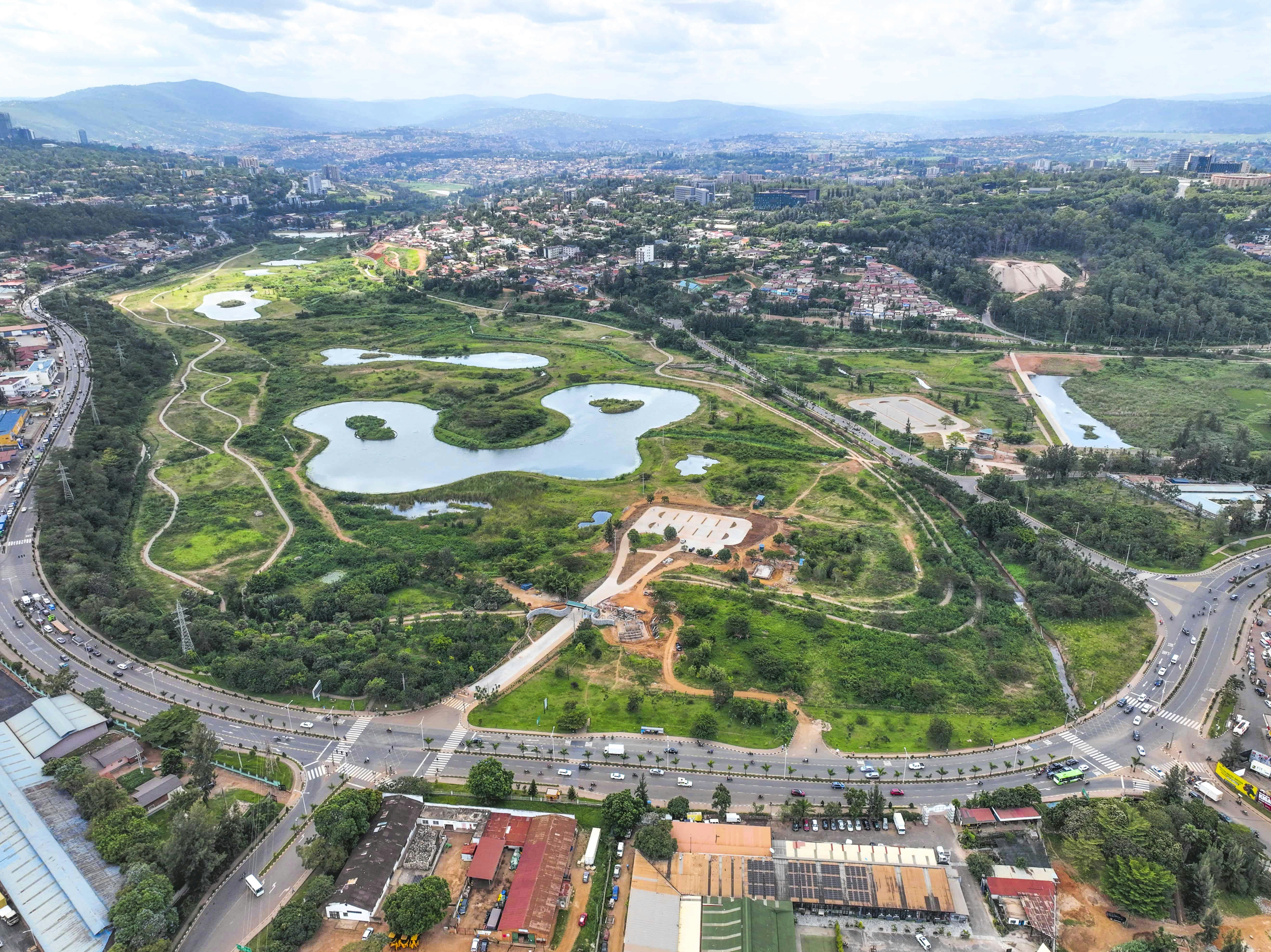 An aerial view of Nyandungu Eco-Park with winding paths and ponds in Kigali