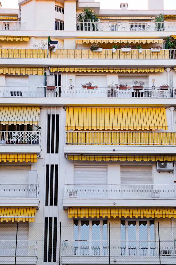 Multi-story apartment building exterior, no people