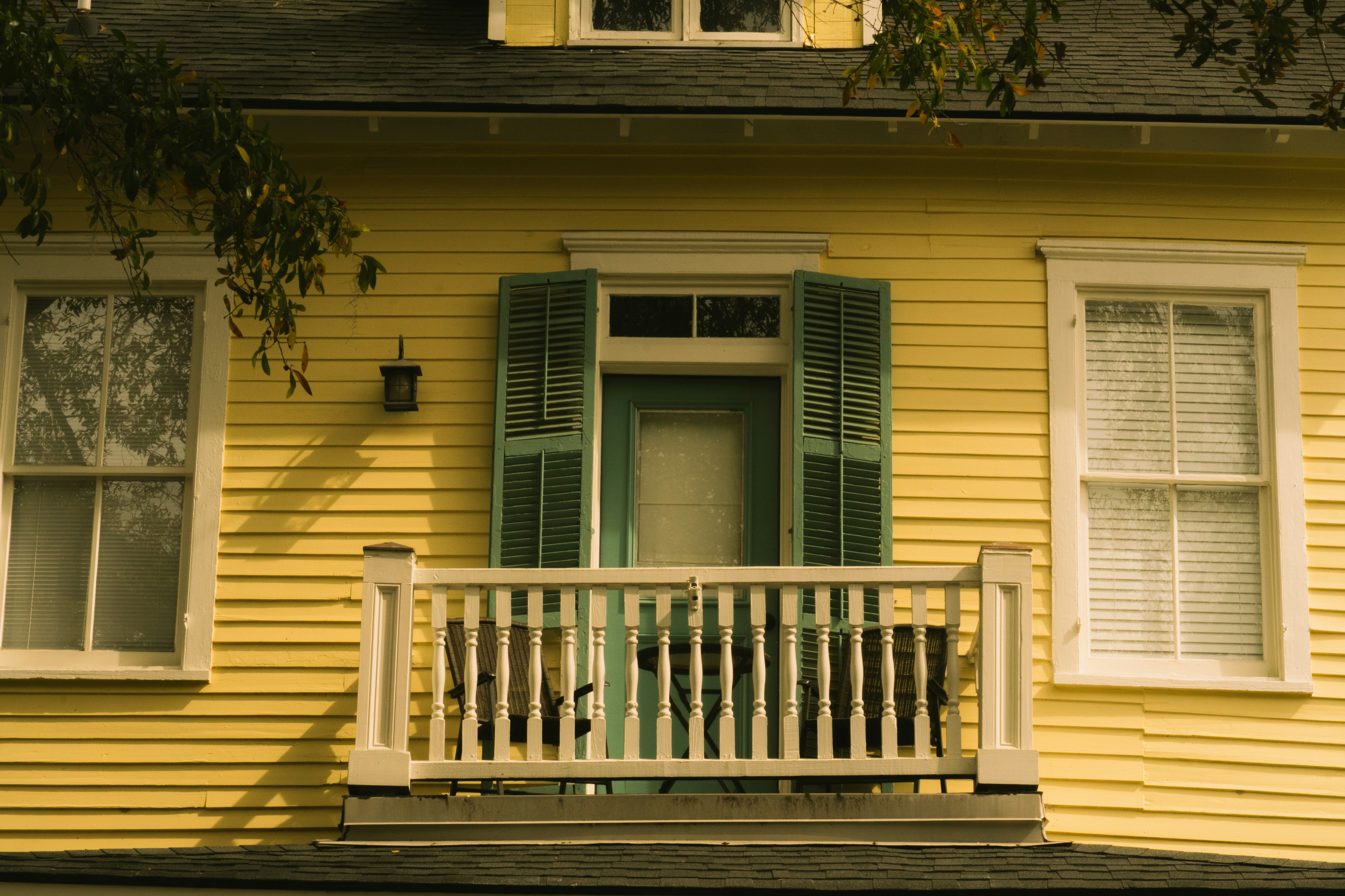 A weathered single-family rental house exterior.