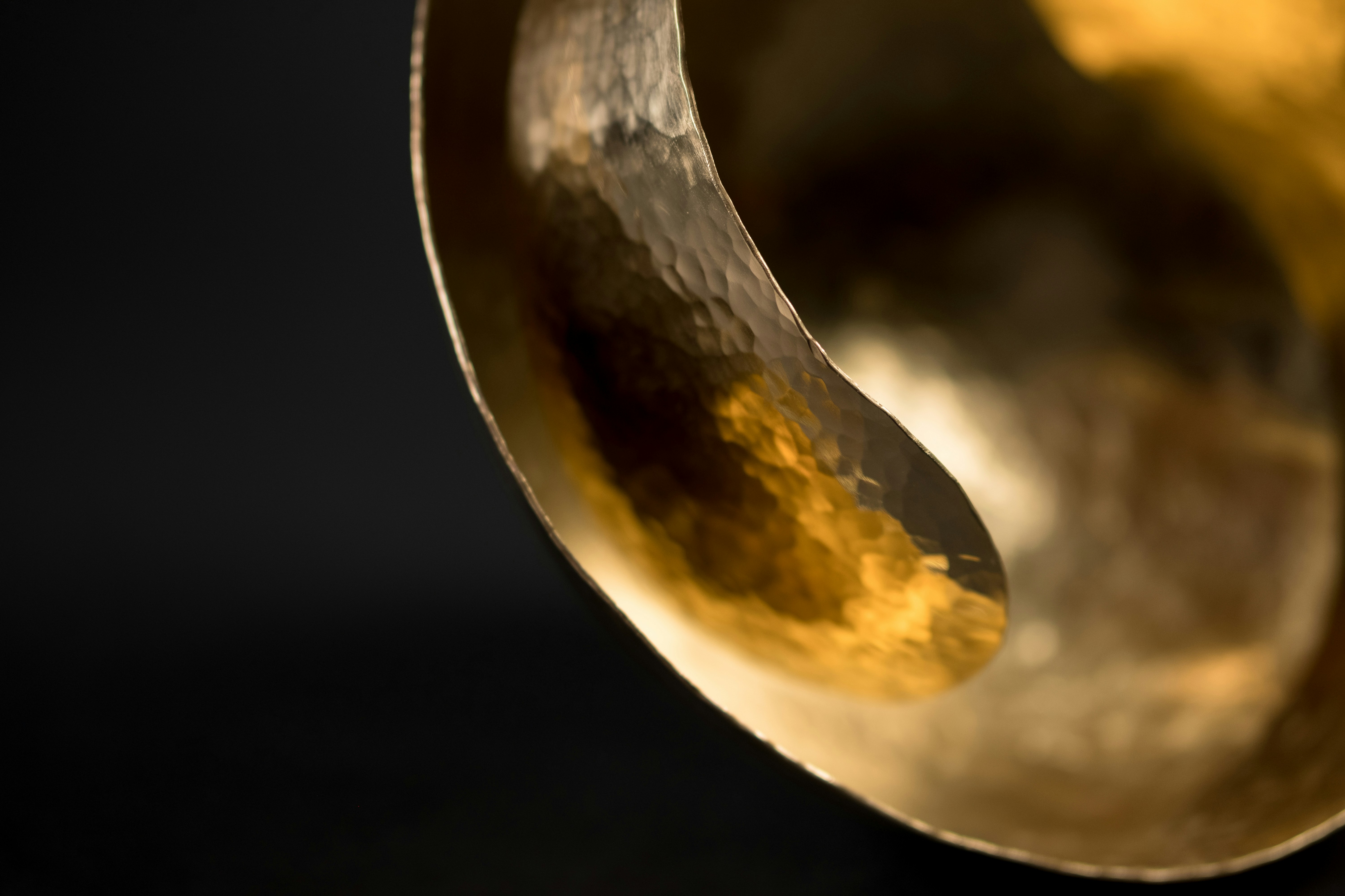 Hand-hammered brass with a warm unlacquered sheen