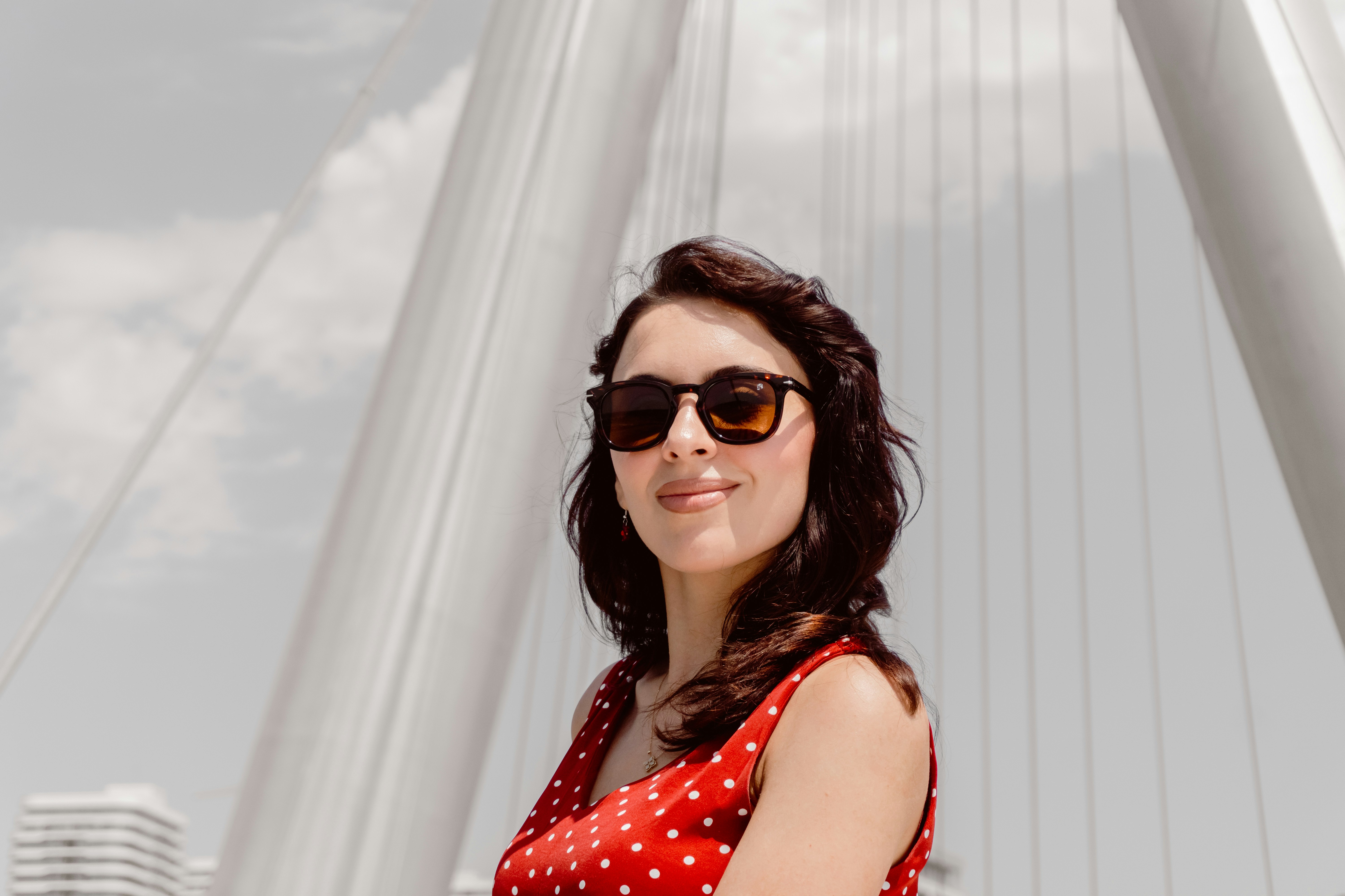 Confident woman in sunglasses enjoying a summer day