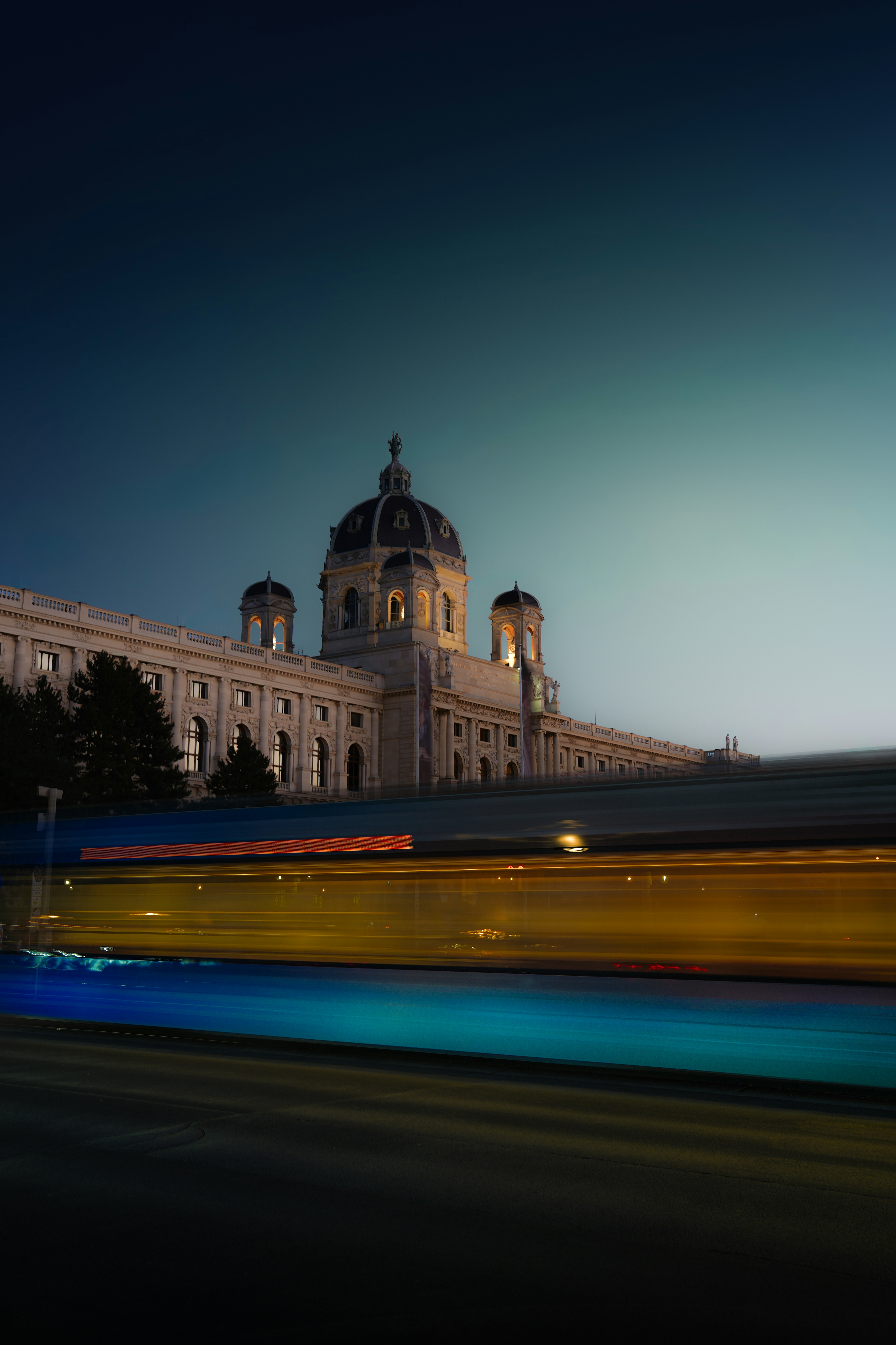 The Kunsthistorisches Museum in Vienna with long exposure light trails from a passing tram