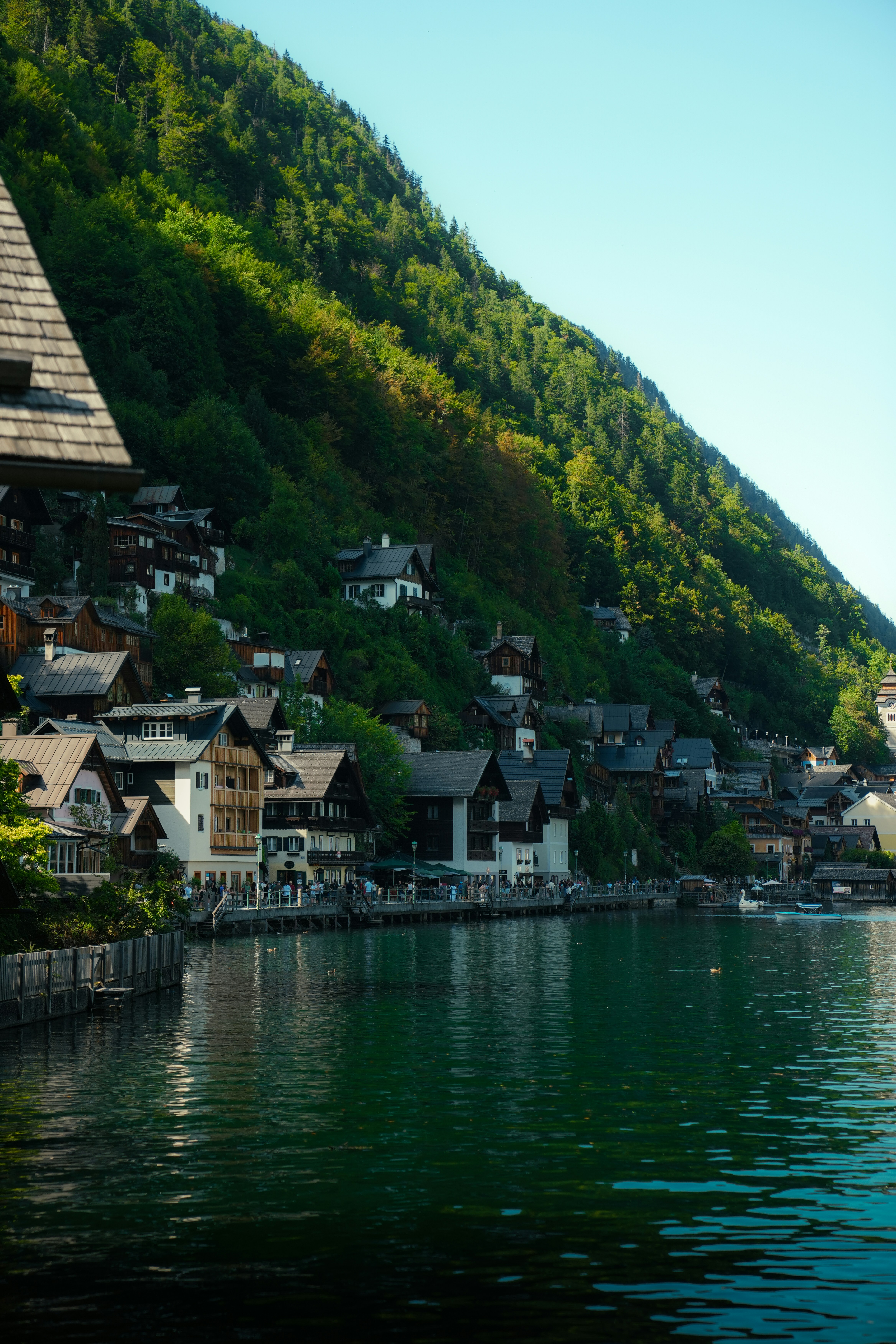 Traditional wooden houses along the shore of Hallstatt lake in Austria