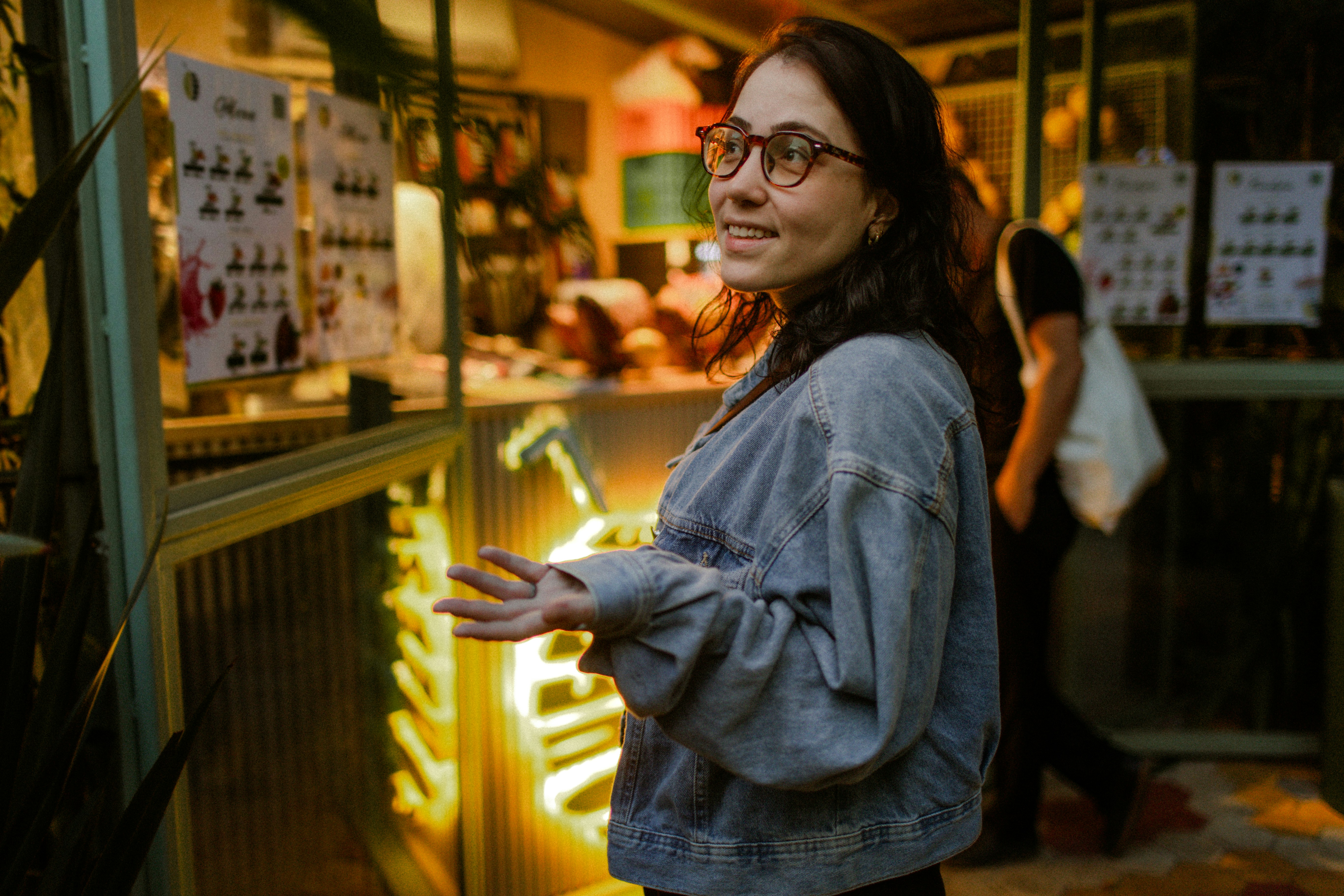 Woman in denim jacket near neon - Free Photo on Unsplash