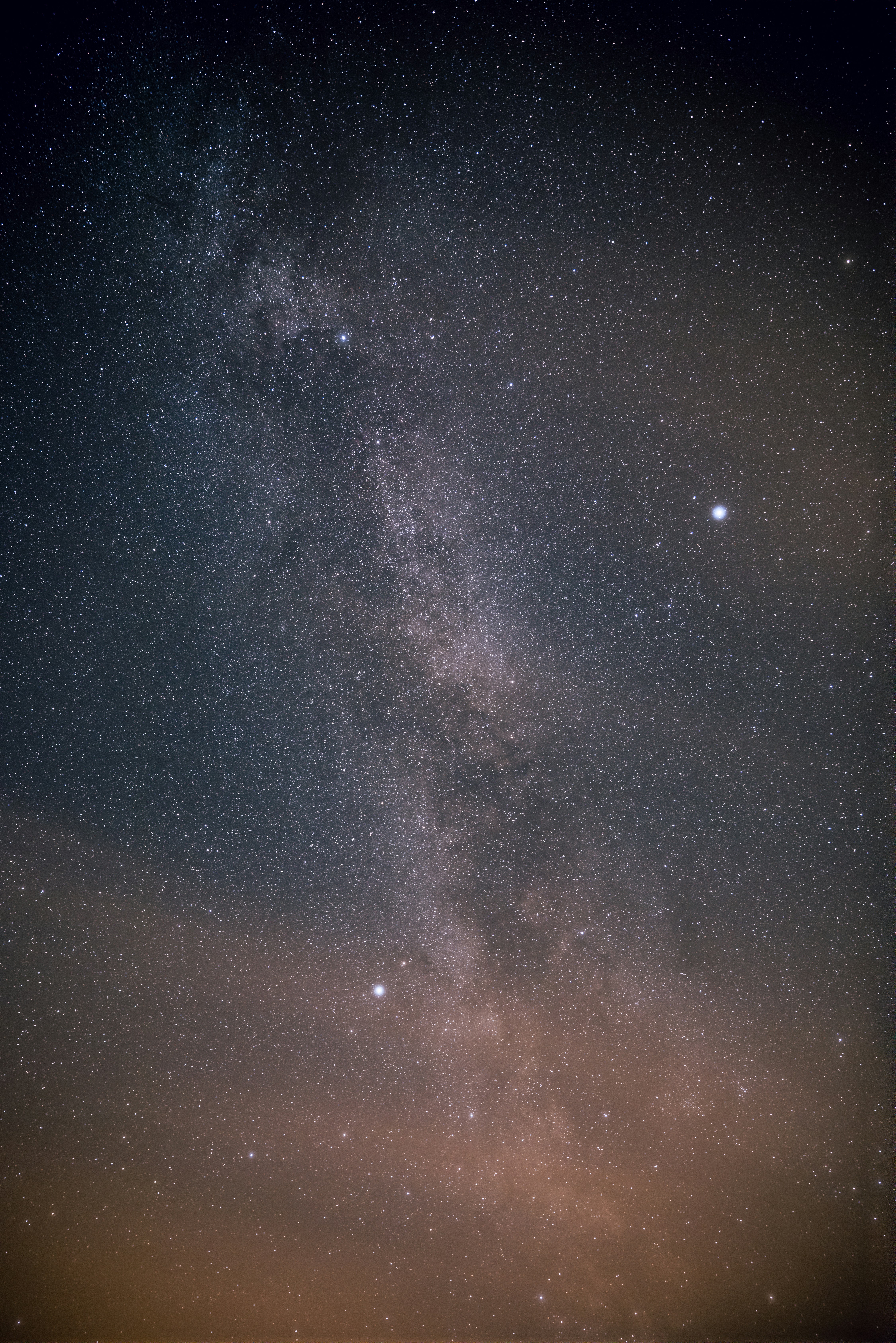 The Milky Way galaxy stretching across a dark night sky filled with stars