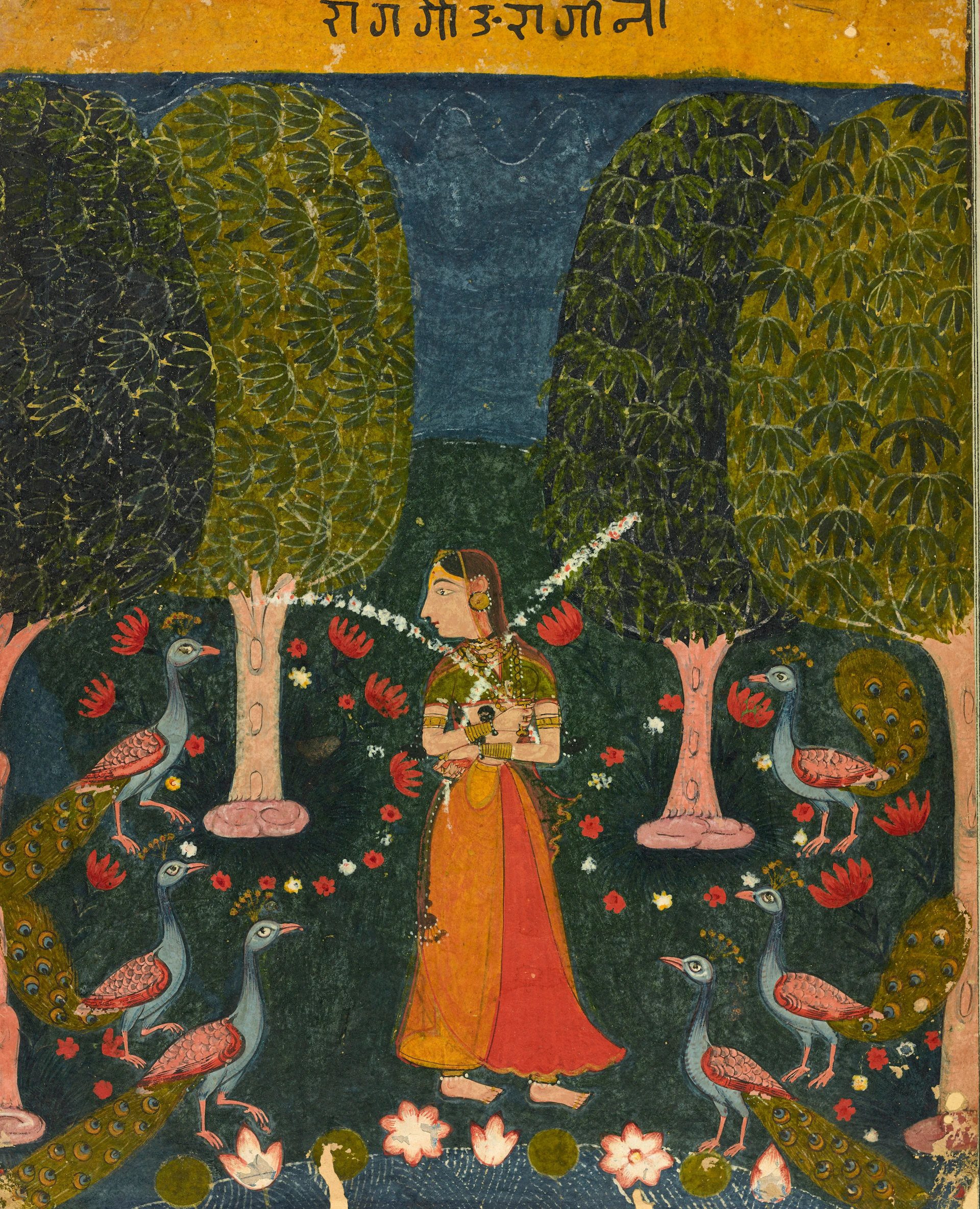 A woman in traditional clothing standing among four peacocks in a lush garden