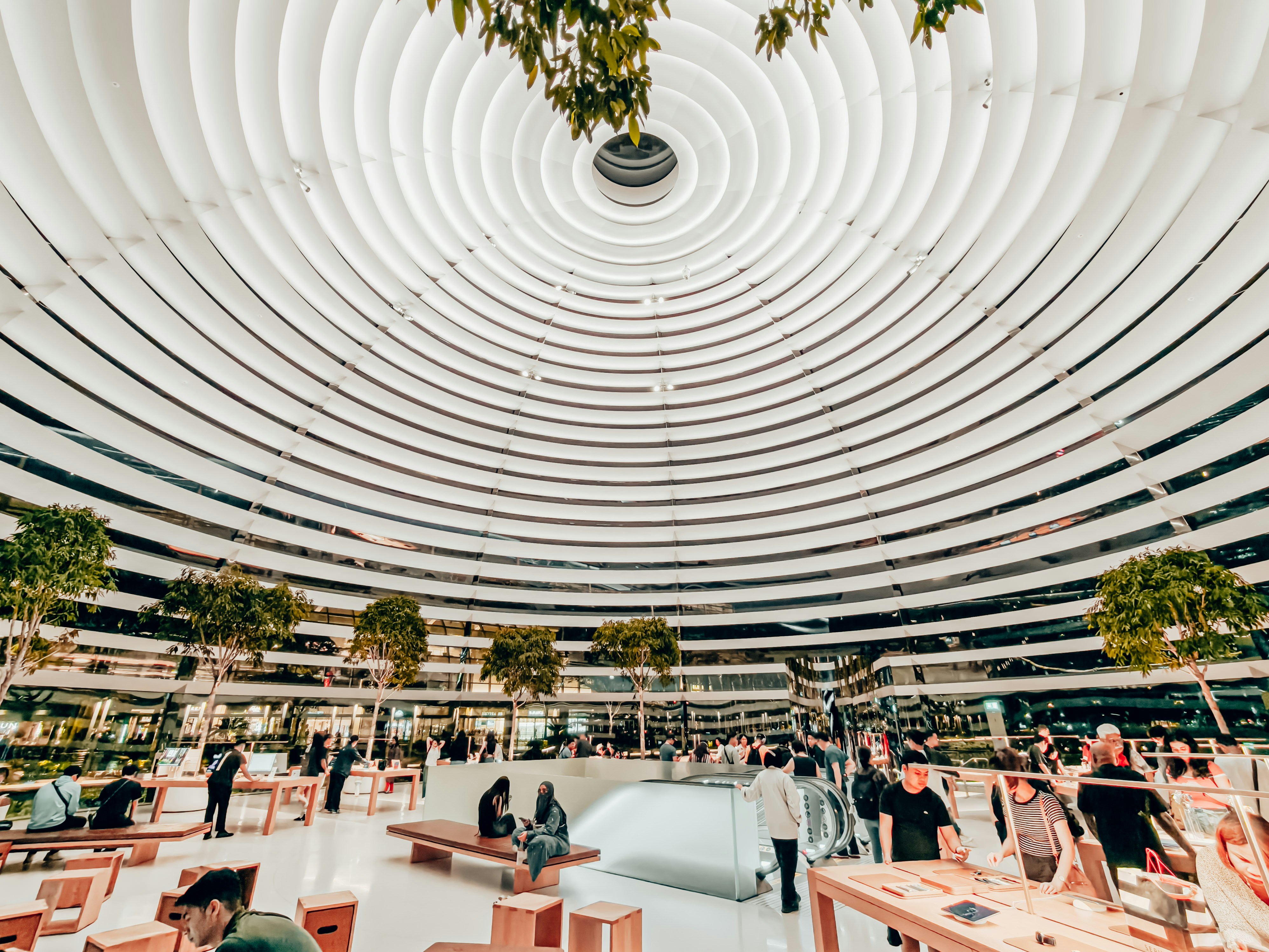 Shoppers in a modern circular atrium