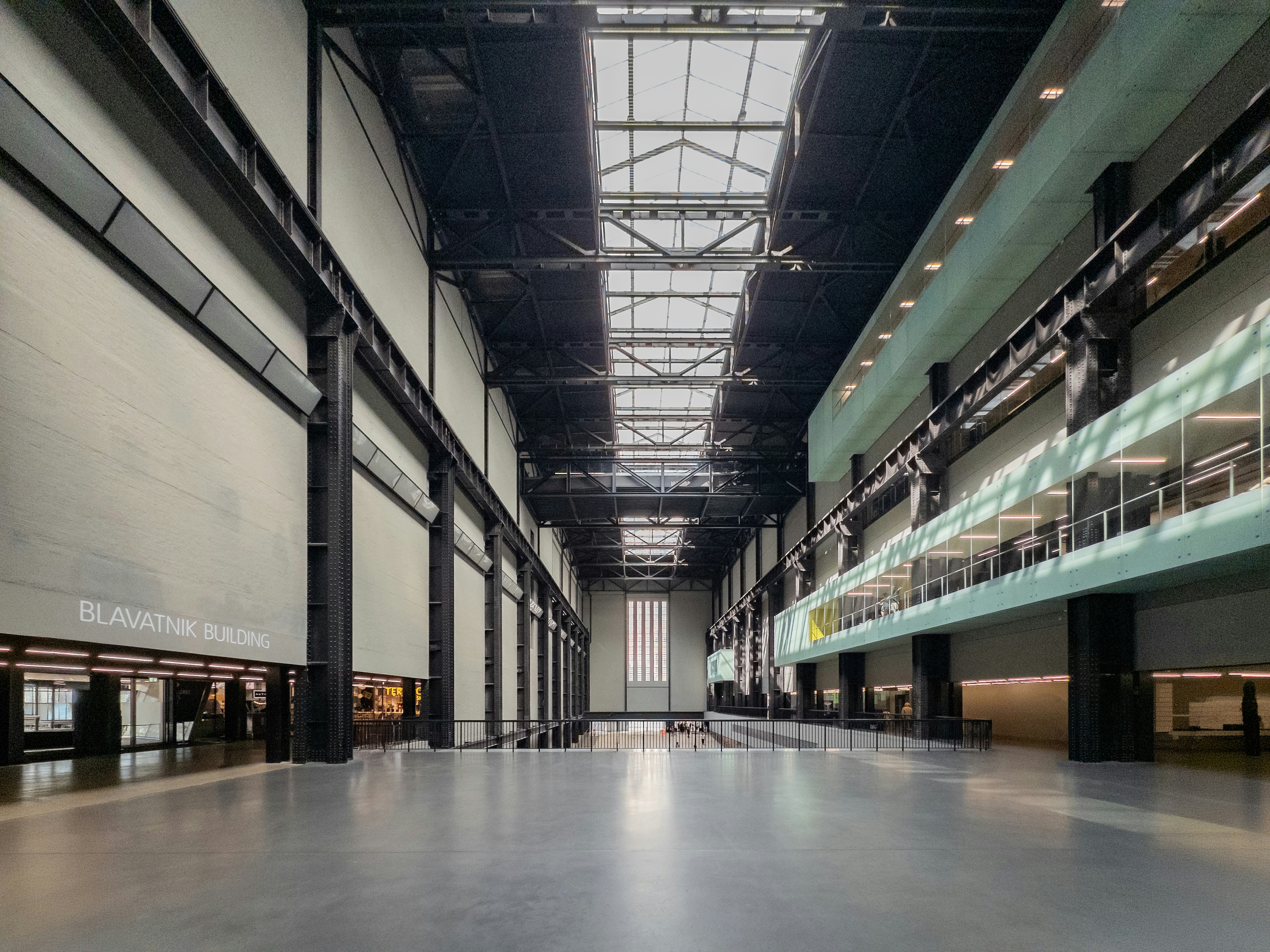 The vast industrial turbine hall of the Tate Modern in London with high ceilings