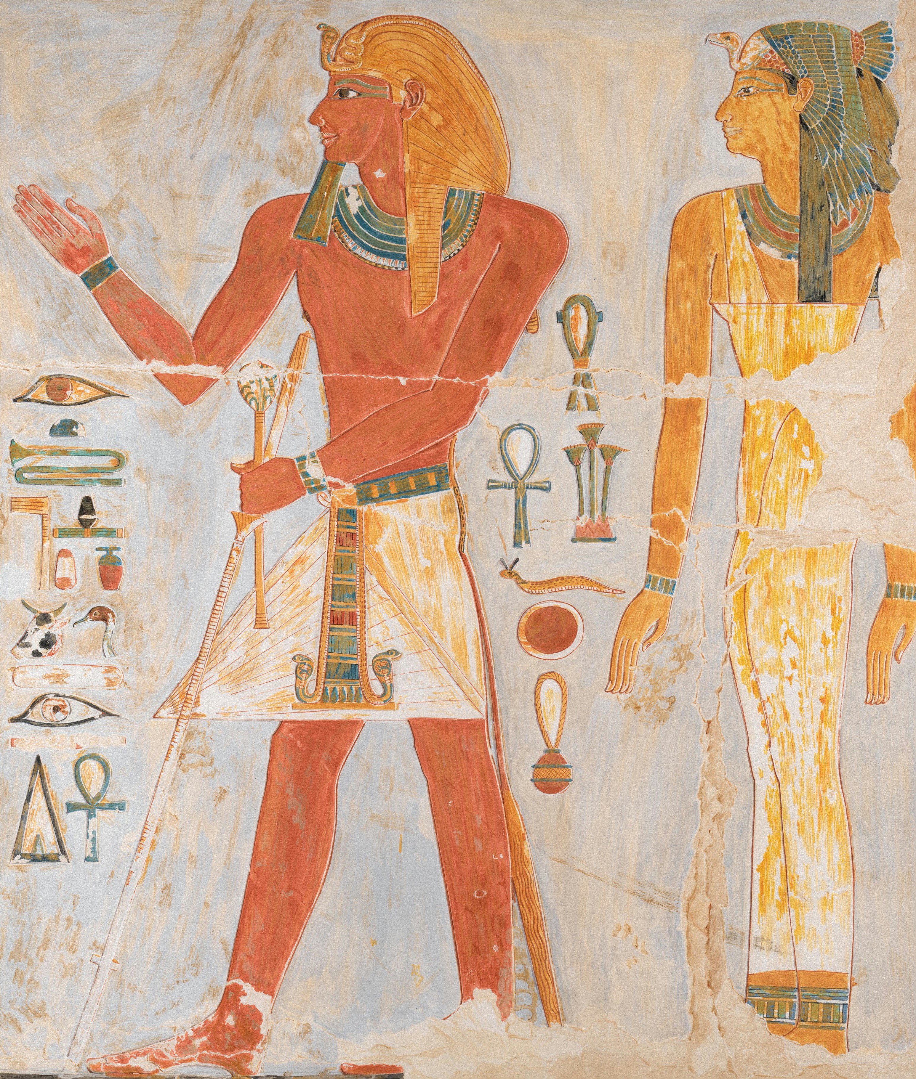 Ancient Egyptian wall painting of a pharaoh and a queen with hieroglyphs