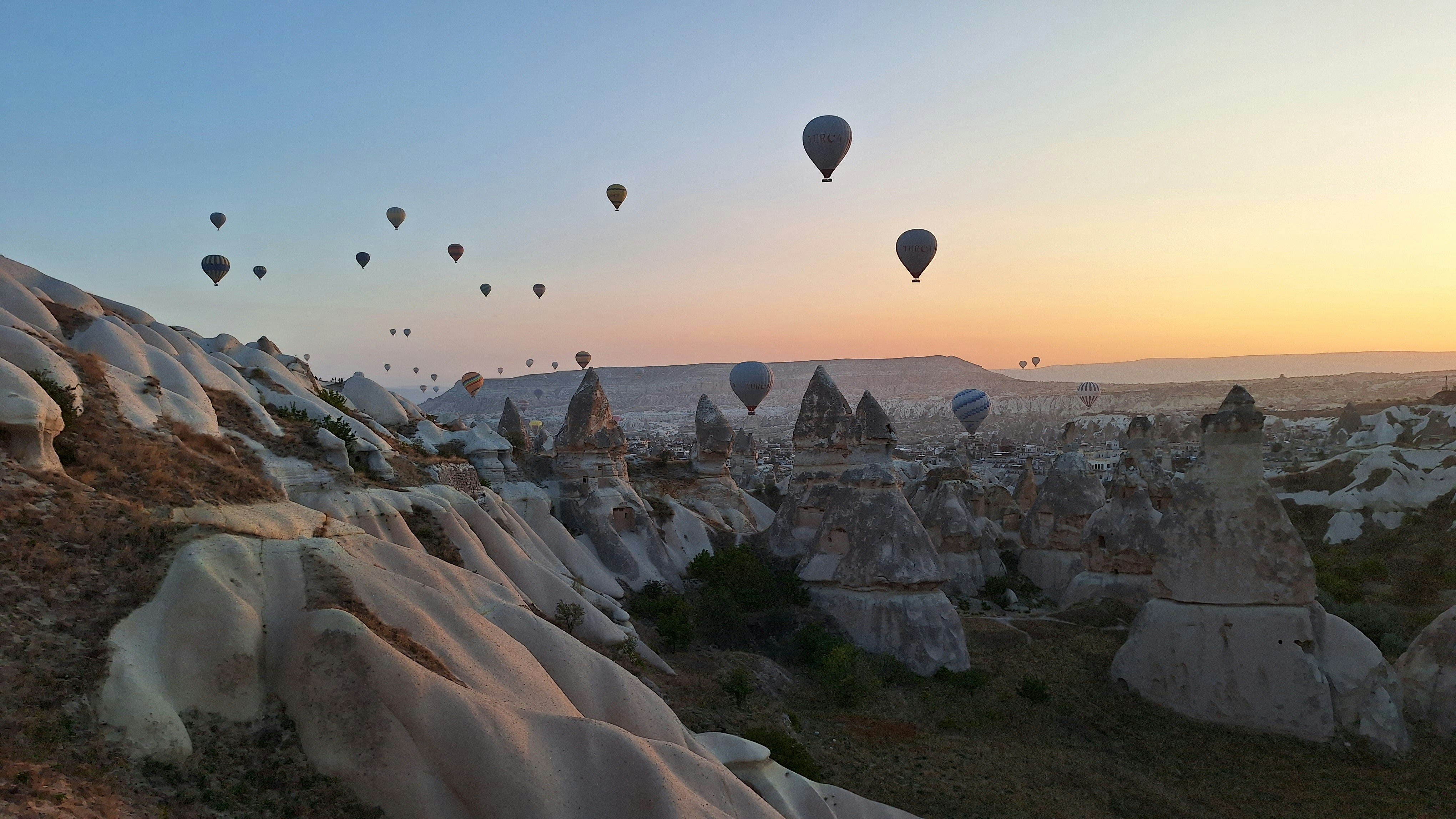 Hot air balloons over the fairy chimneys of Cappadocia at dawn