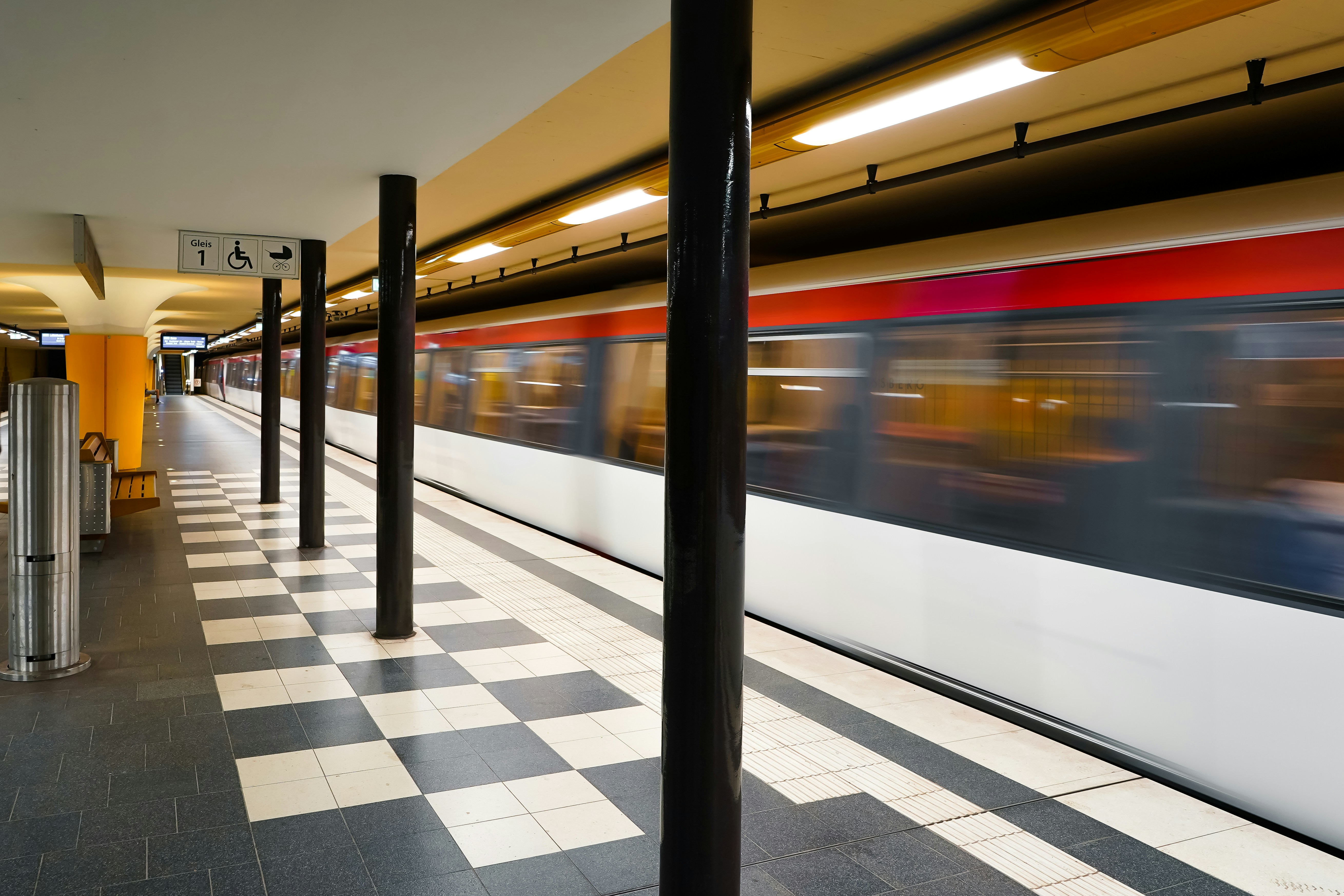 Blurred train passing an underground station