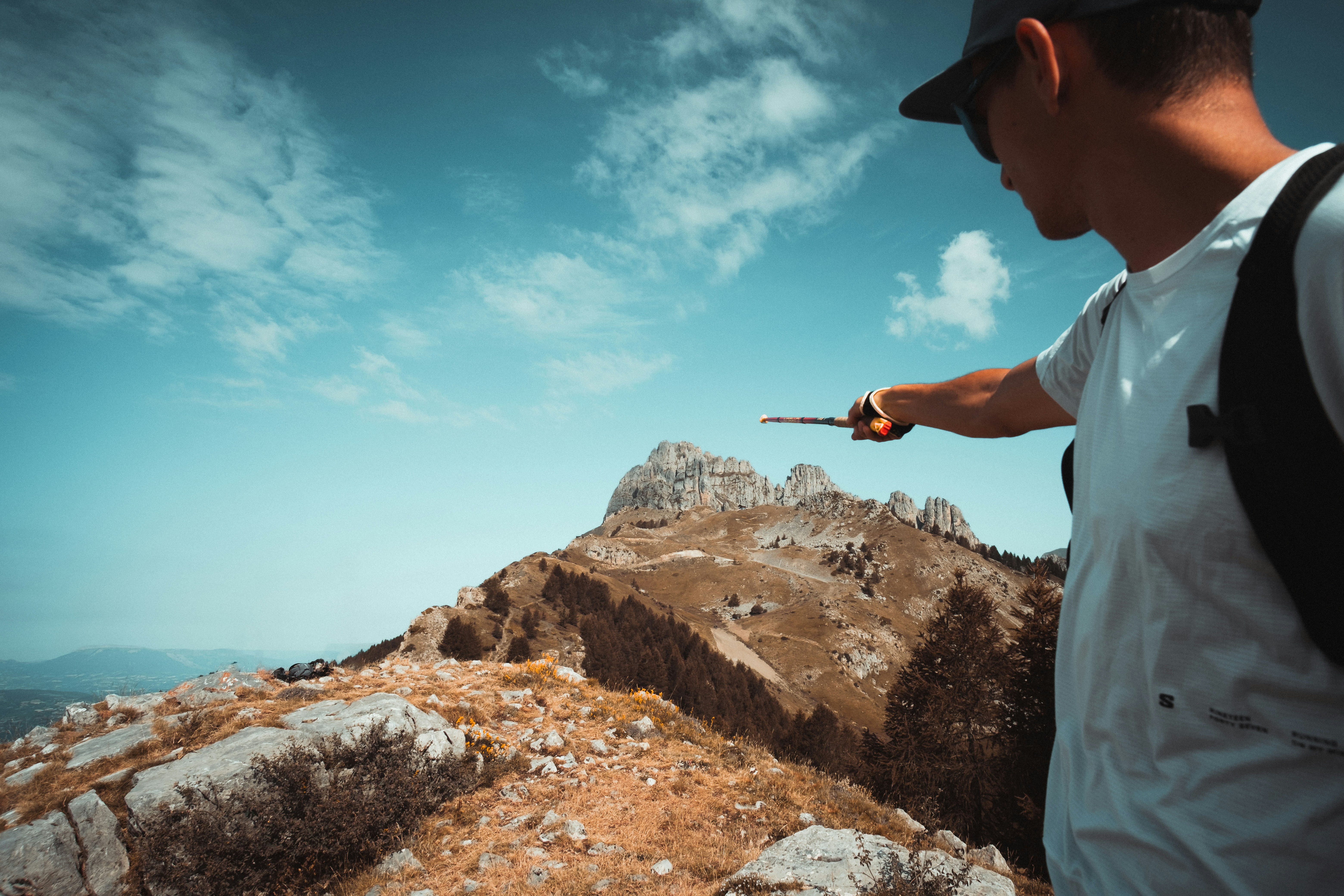 hiker checking smartwatch mountain trail