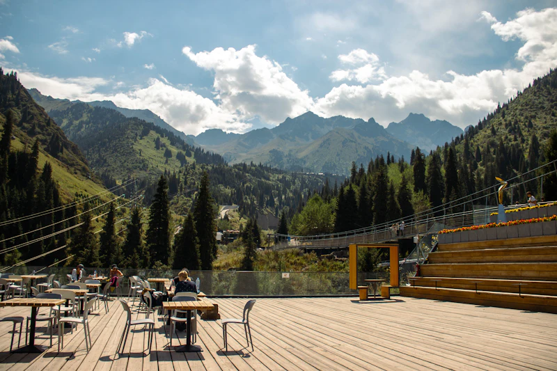 A mountain cafe deck above a forest