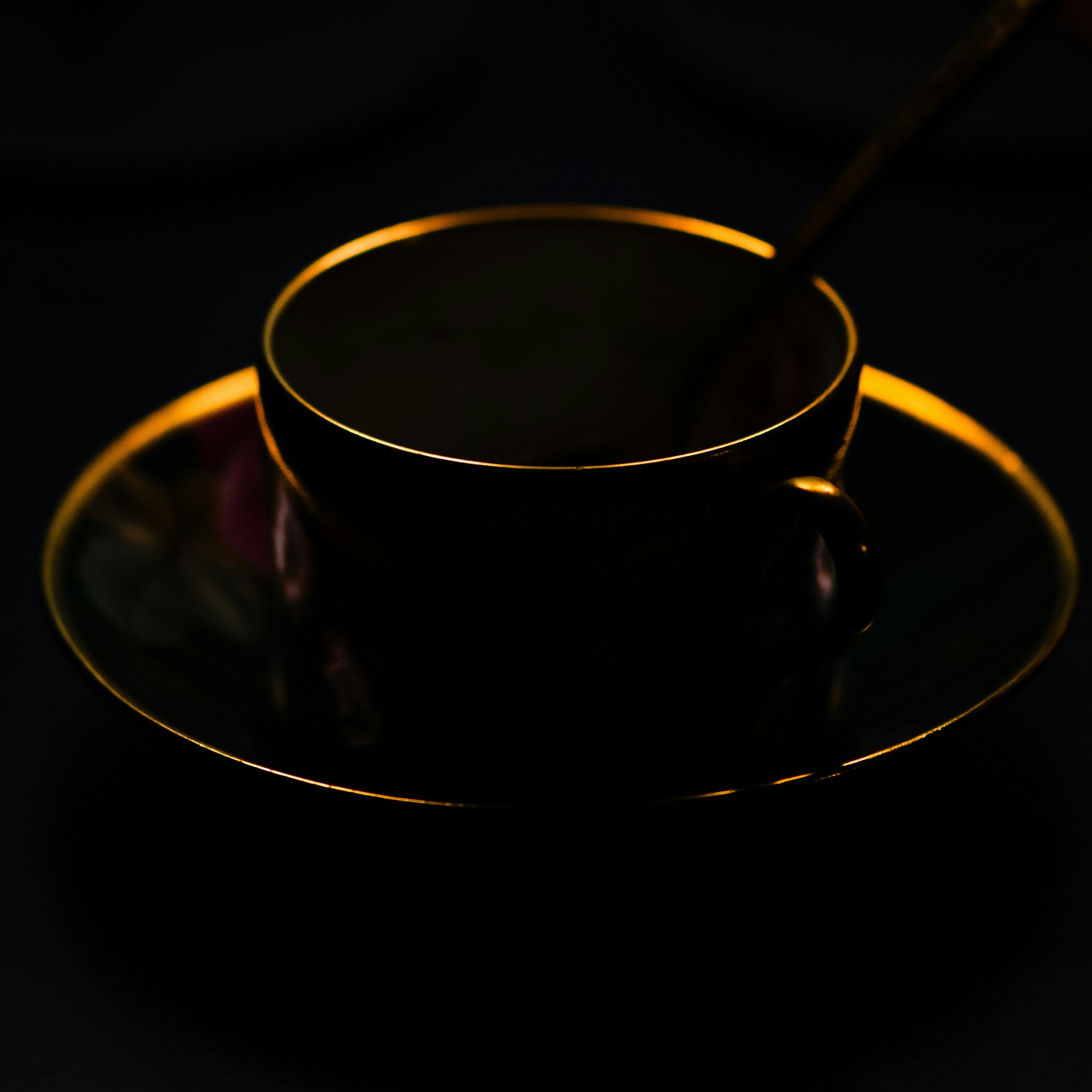 Kazims Flavor Fusion Tea served in a dark cup with a golden rim