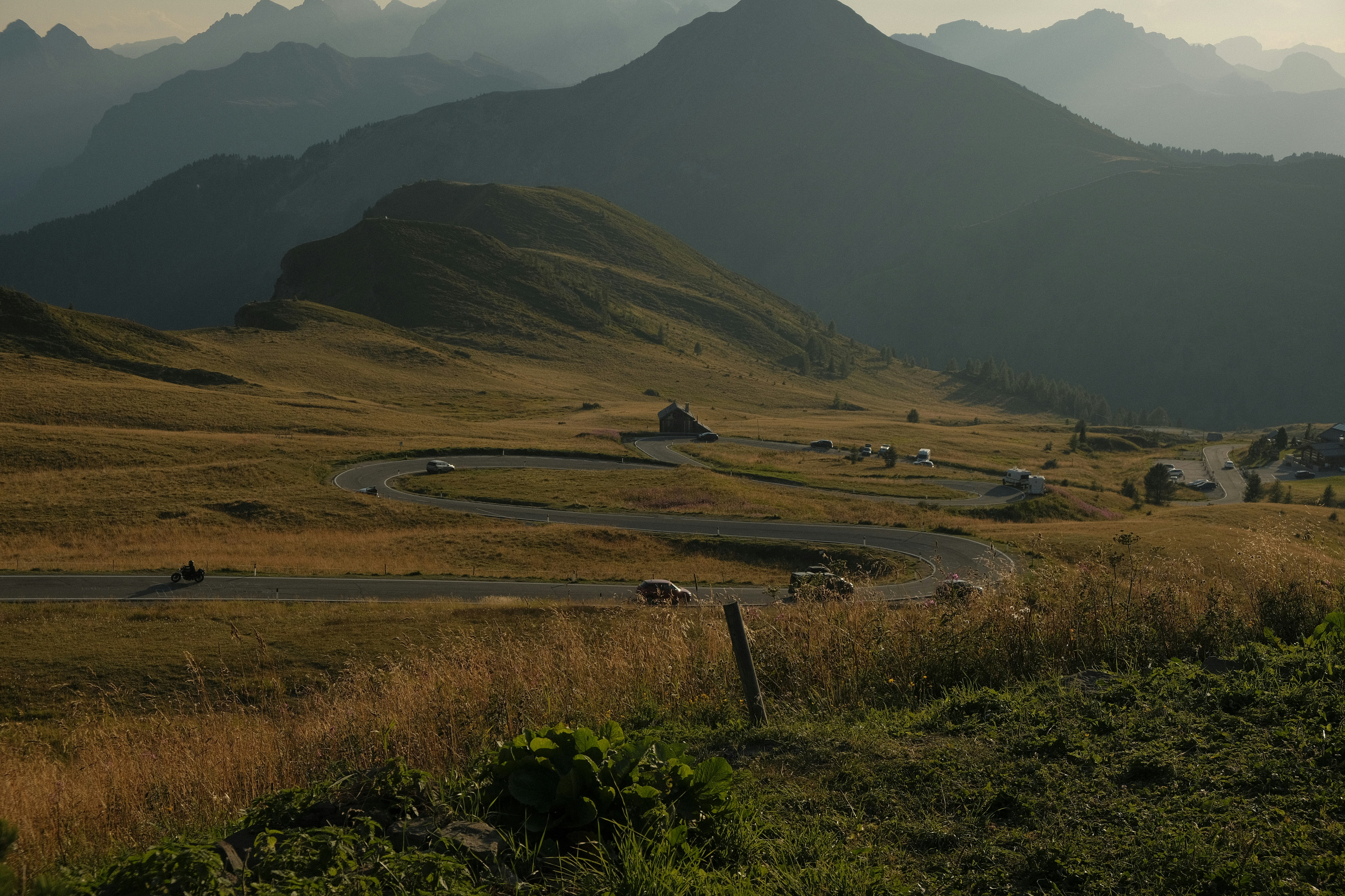 Winding Mountain Road Through a Grassy Valley with