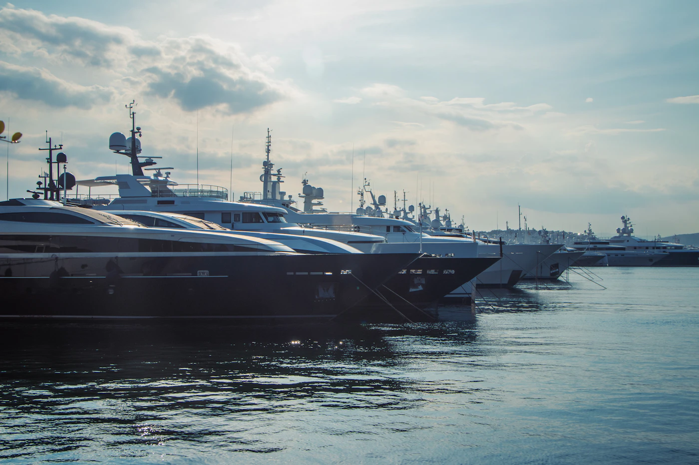 Aerial view of a large superyacht under way in open water
