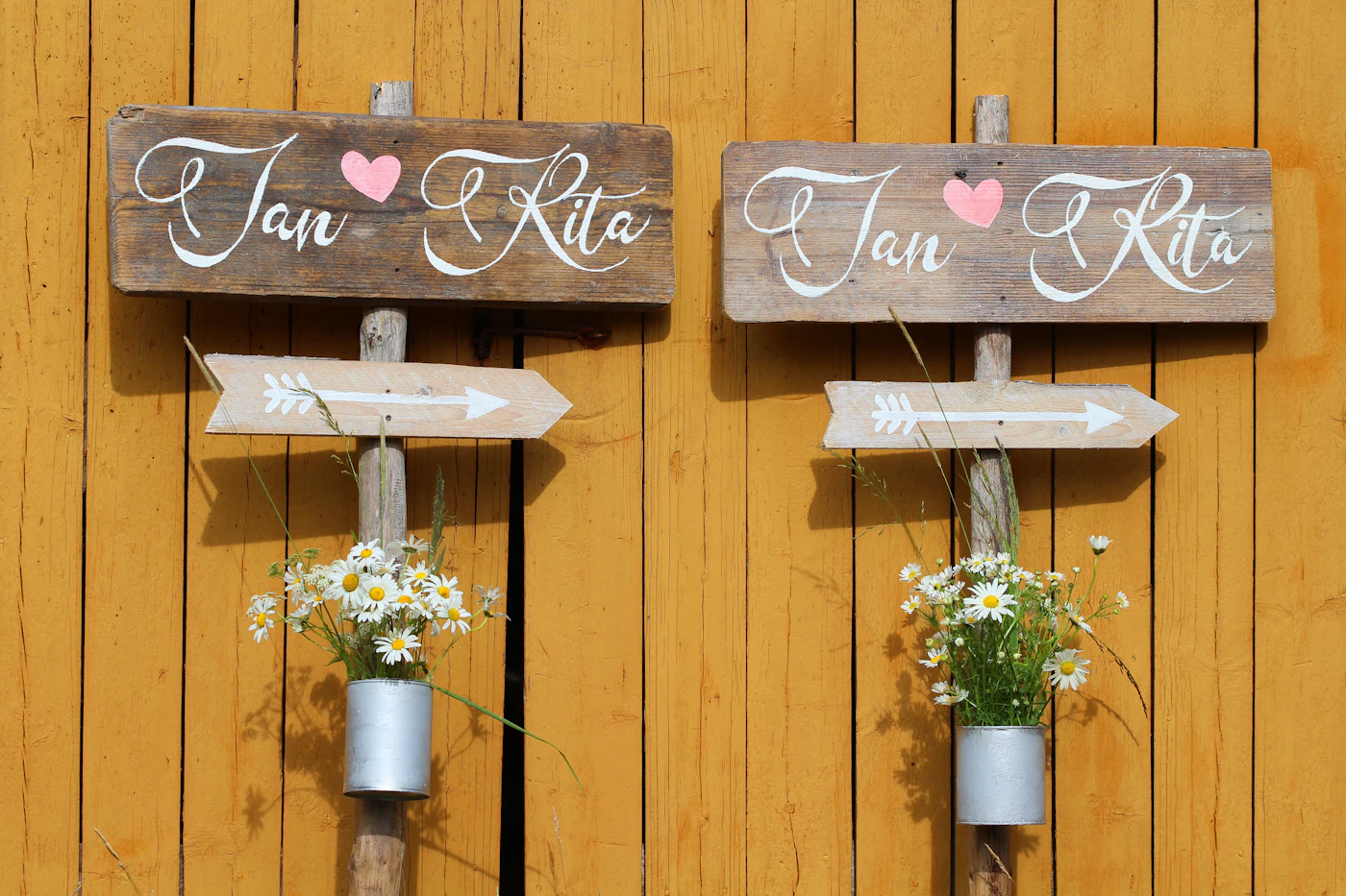 DIY wedding signage for rustic themes — A DIY seating chart display made with string and kraft paper tags.