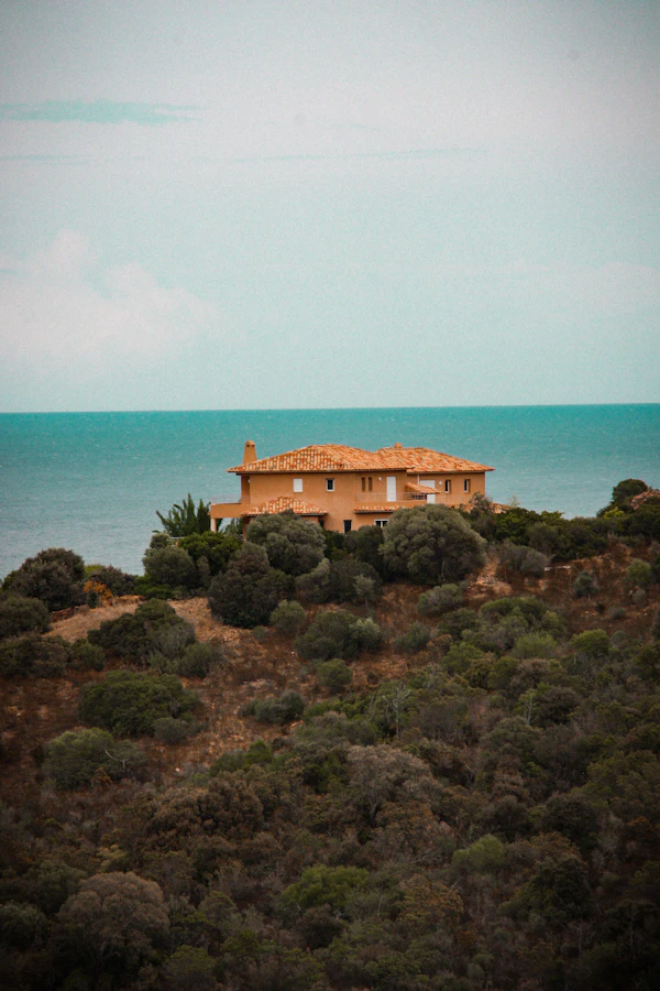 Villa with a terracotta roof on a hill overlooking the sea