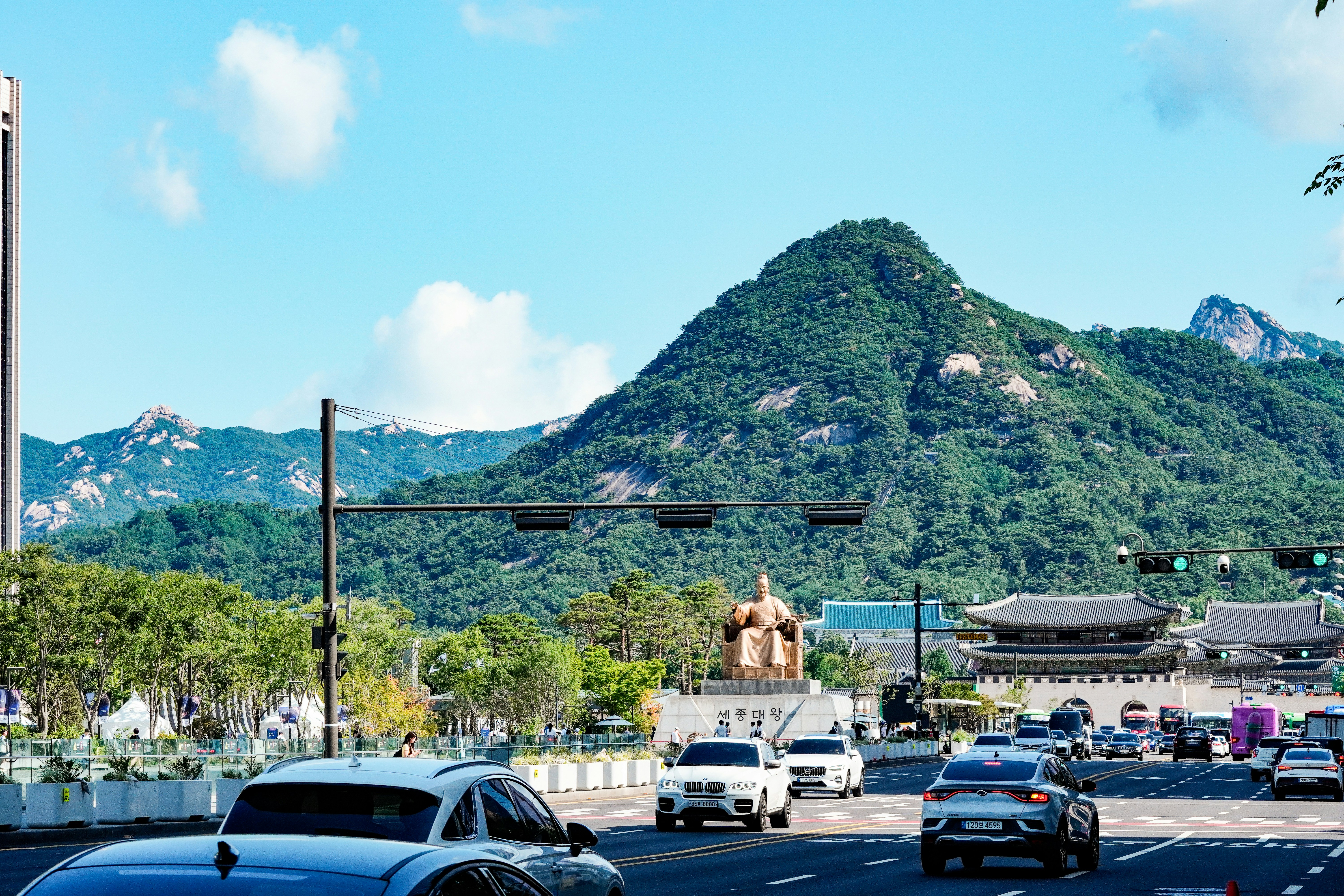 King Sejong statue on Gwanghwamun Square with Bugaksan mountain in Seoul