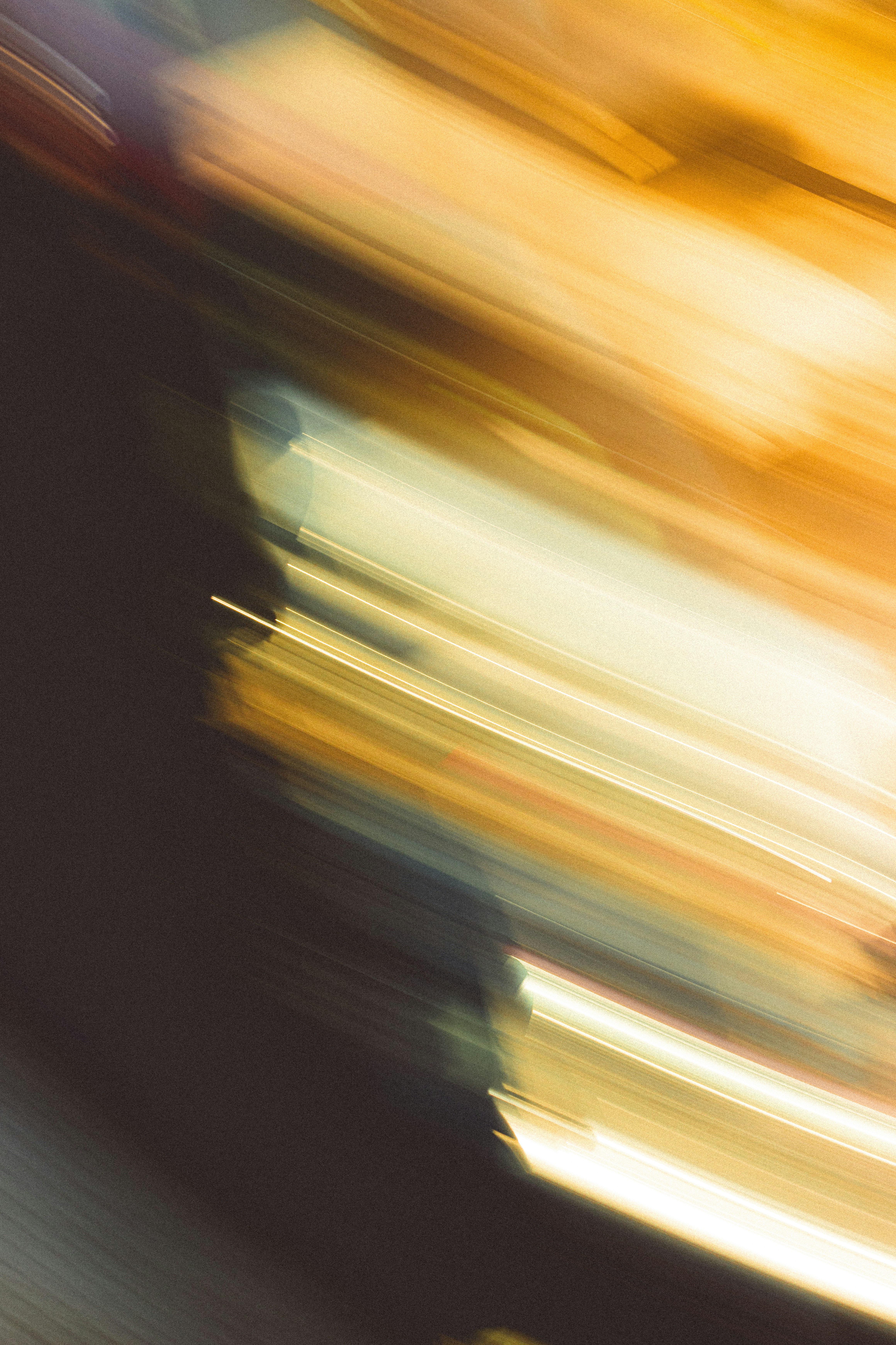 Abstract motion blur with streaks of bright yellow and white light