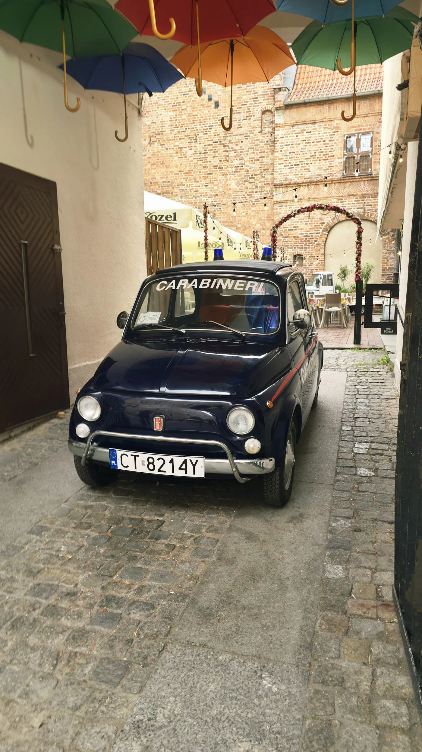 An Italian Carabinieri car on a cobblestone street