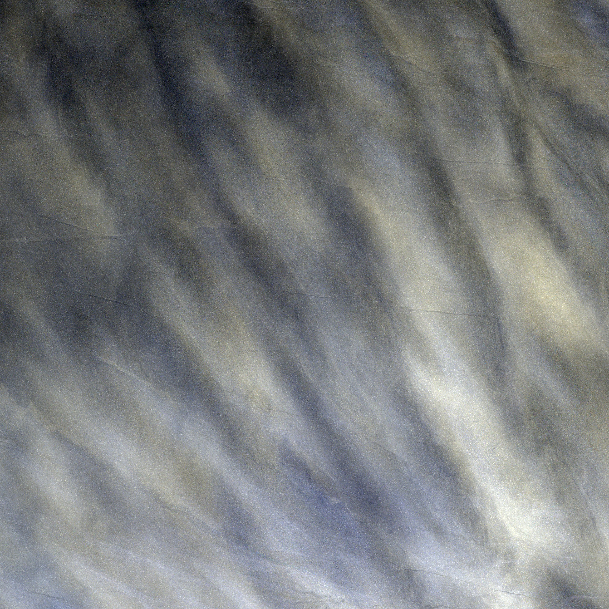 Abstract grey and white marble texture with diagonal veining