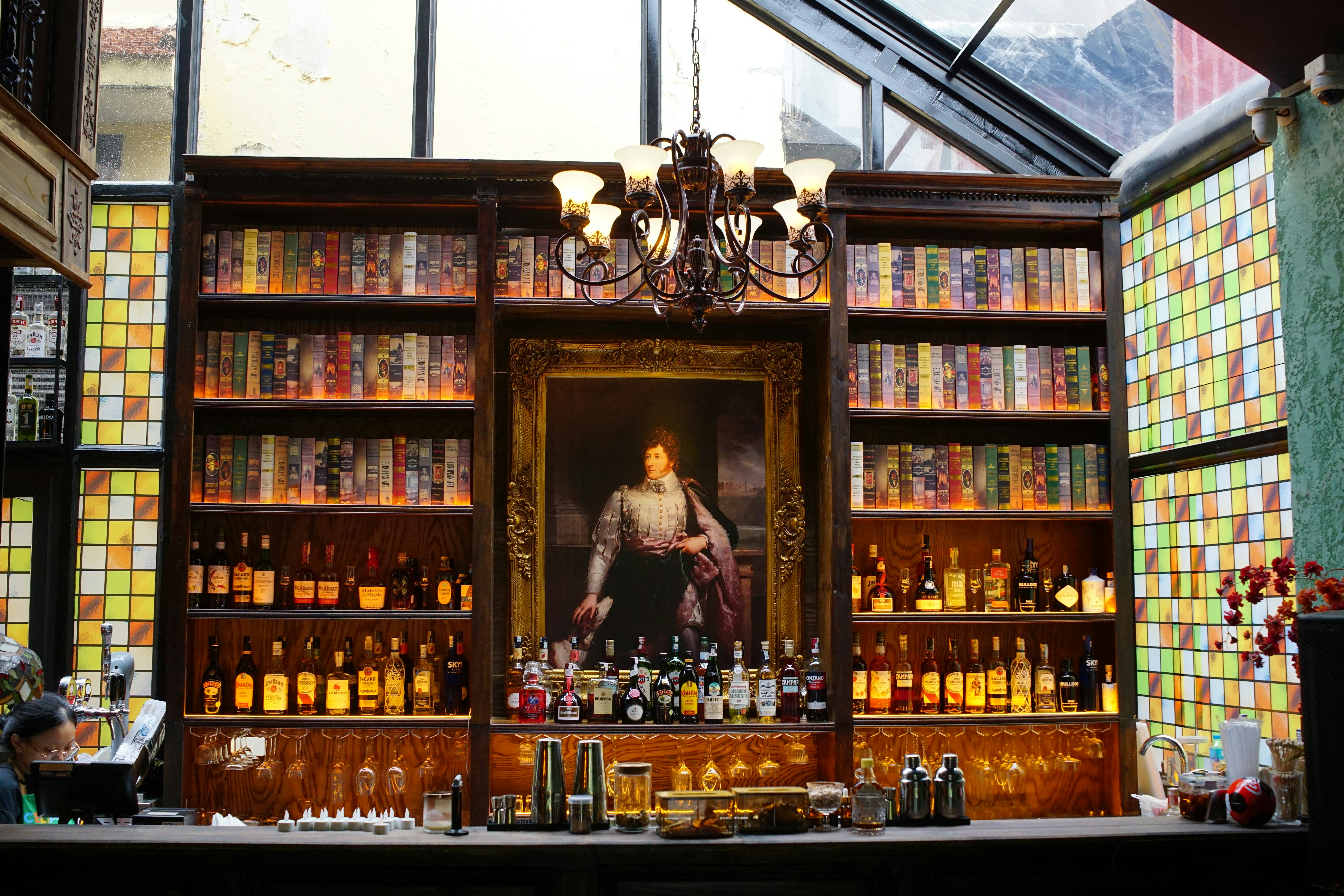 Bar with books and liquor shelves