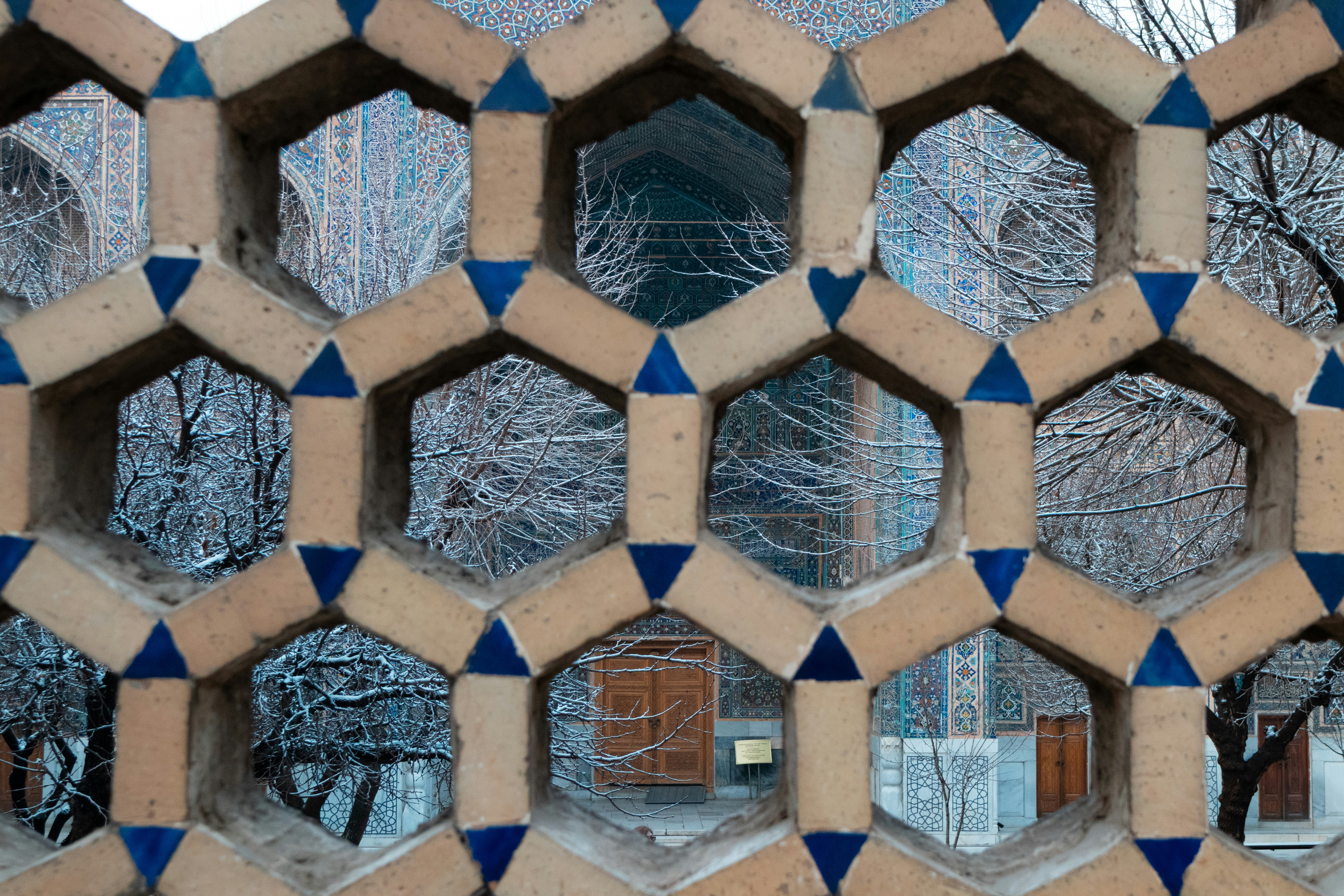 Hexagonal brick lattice screen and building - Free Photo on Unsplash