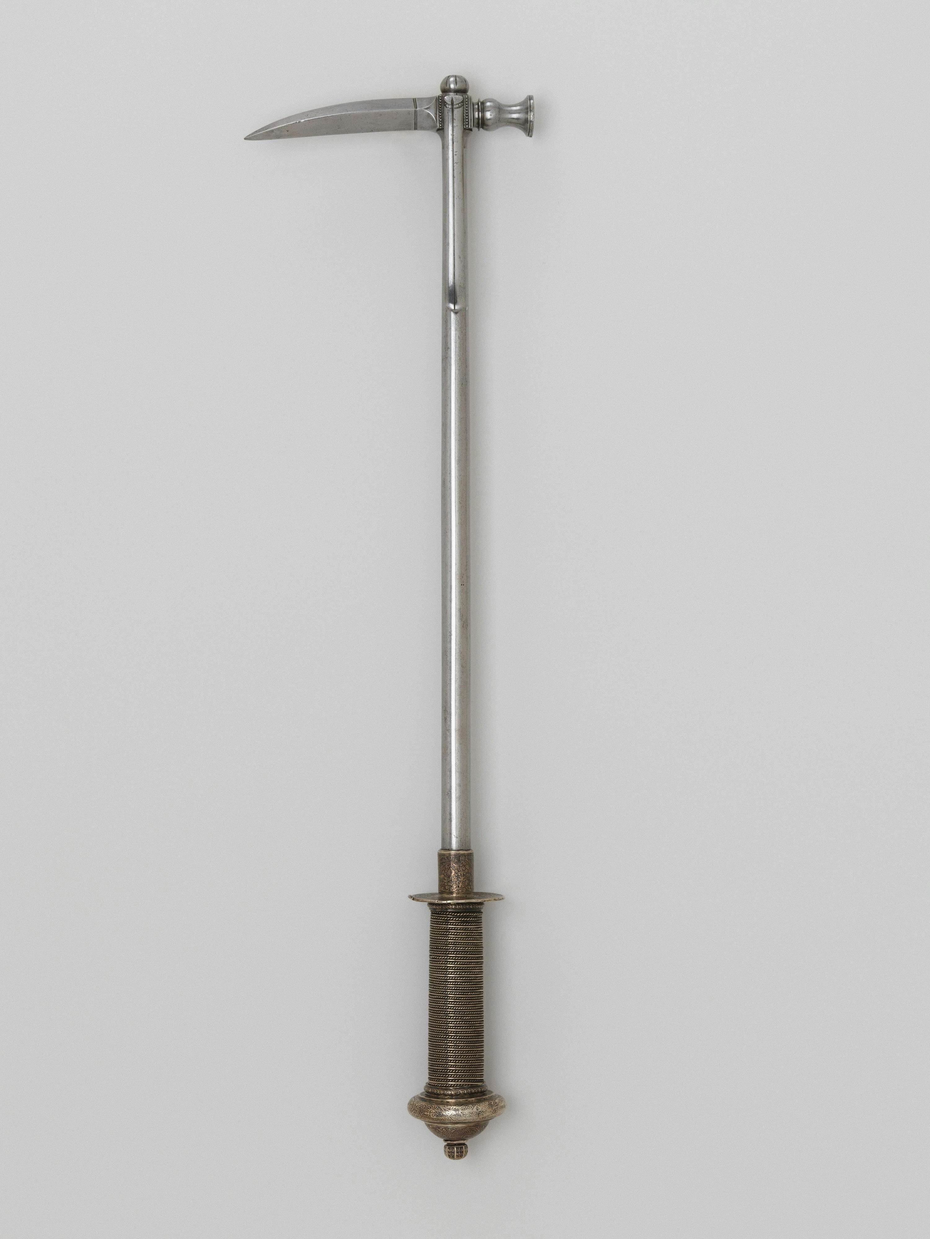 Title: War Hammer,Date: mid-16th century,Geography: Saxony,Culture: German, Saxony,Medium: Steel, silver,Dimensions: L. 22 1/2 in. (57.2 cm); L. of head 5 in. (12.7 cm); W. 6 1/8 in. (15.6 cm); Wt. 2 lbs. 8 oz. (1134 g),Classification: Shafted Weapons,Credit Line: Bashford Dean Memorial Collection, Funds from various donors, 1929,Object Number: 29.158.674,Curatorial Department: Arms and Armor
