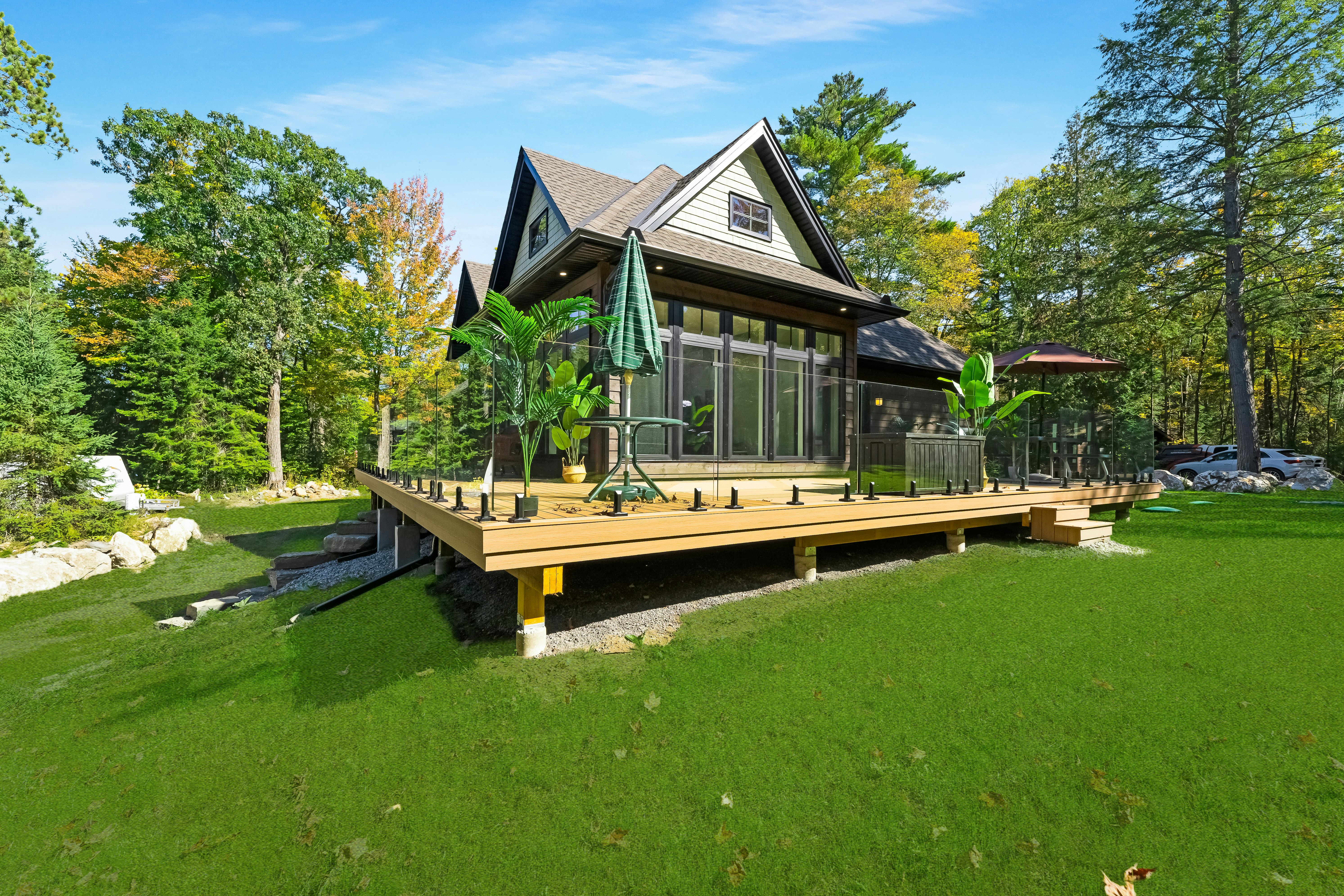A newly built backyard cottage with a deck