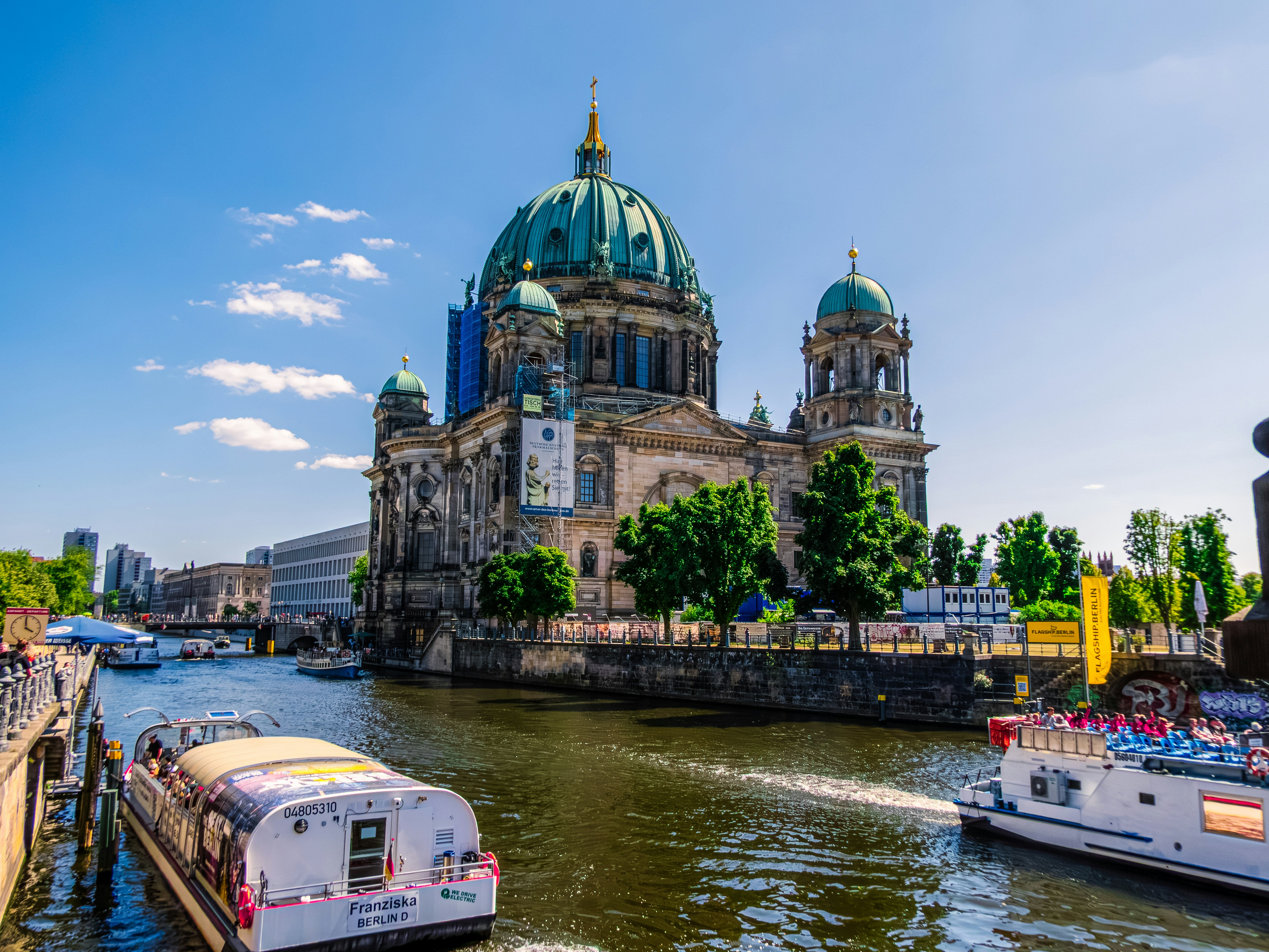 The Berlin Cathedral with its green dome beside the Spree river in Berlin - Münstermaifeld