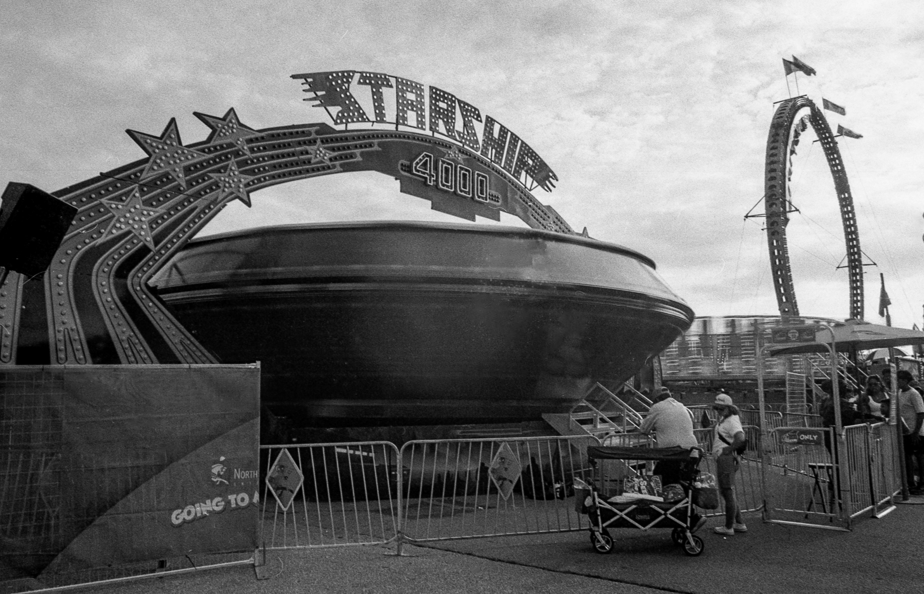The Starship 4000 carnival ride with a large circular platform at a fairground