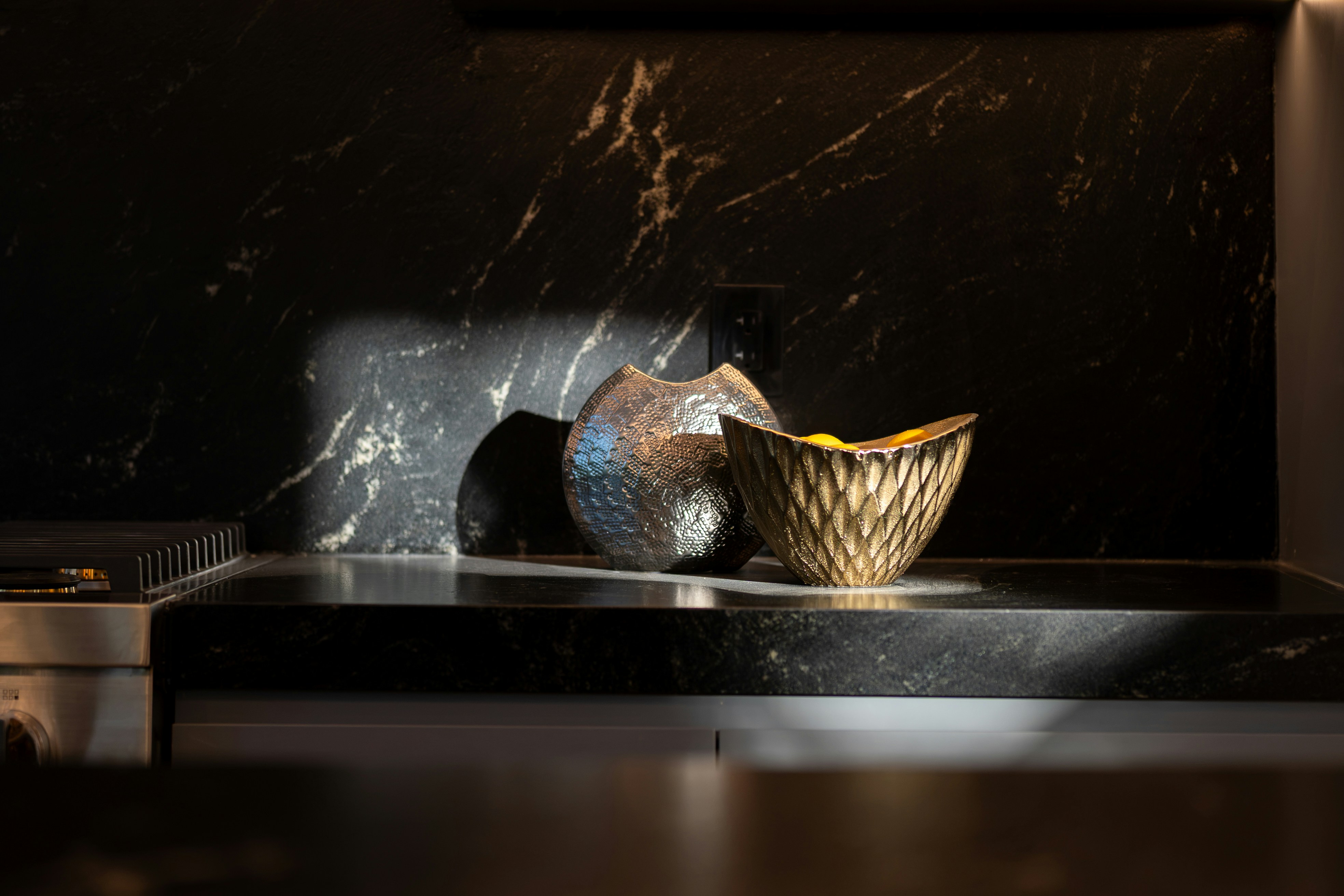 black air fryer on a kitchen counter with french fries in the basket