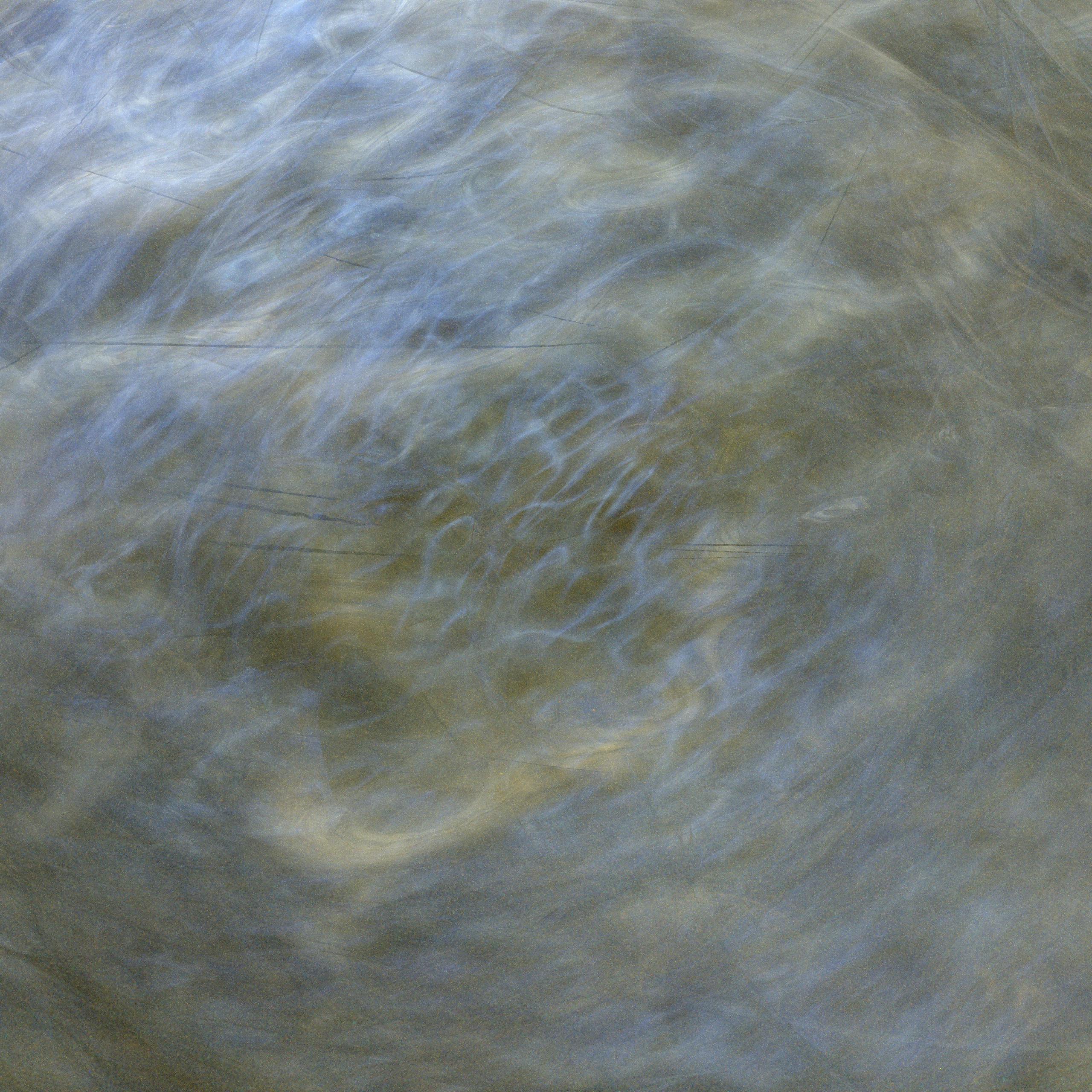 Swirling blue and grey abstract patterns with soft light and motion blur