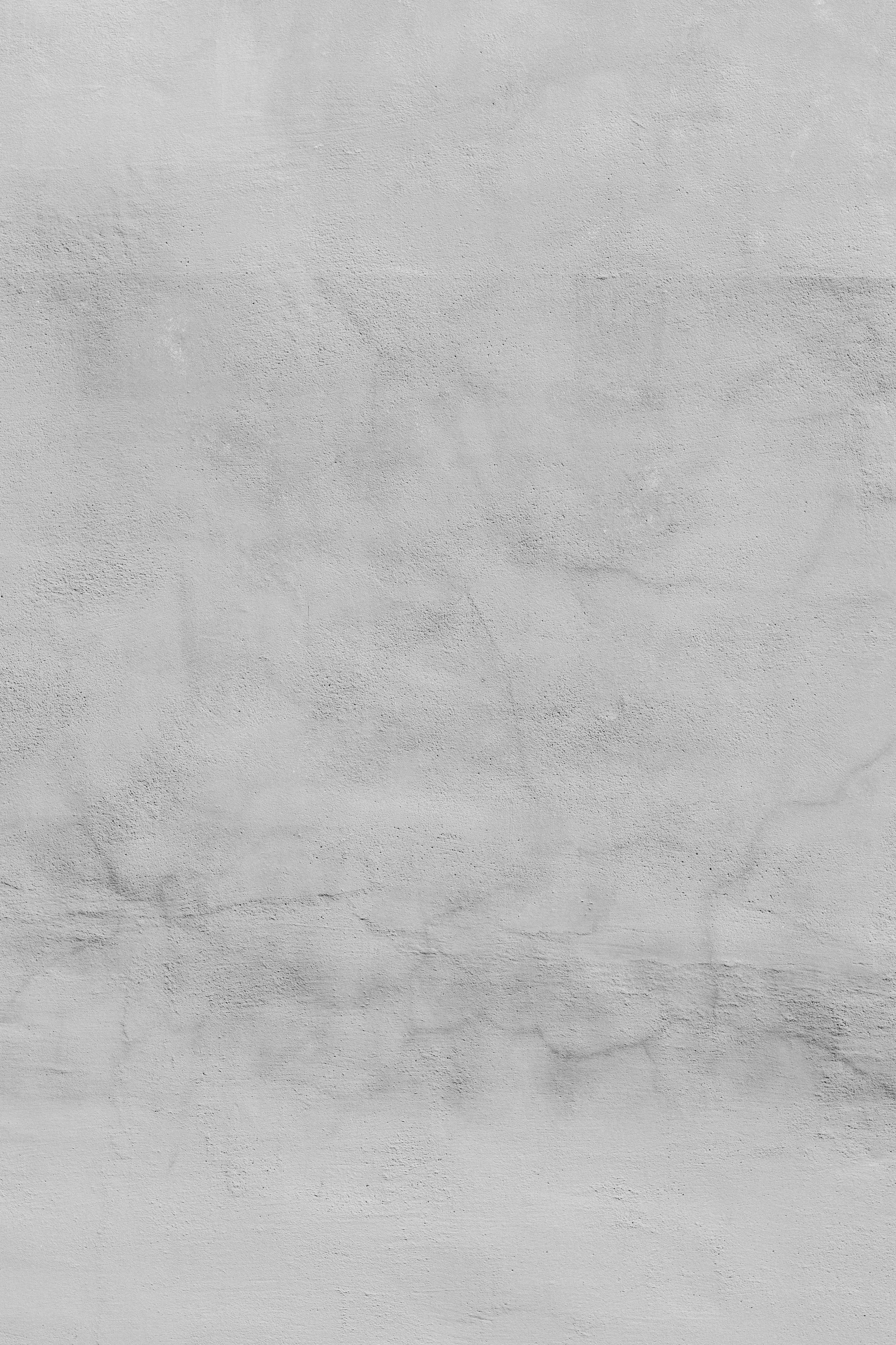 A light grey concrete wall with a subtle textured surface