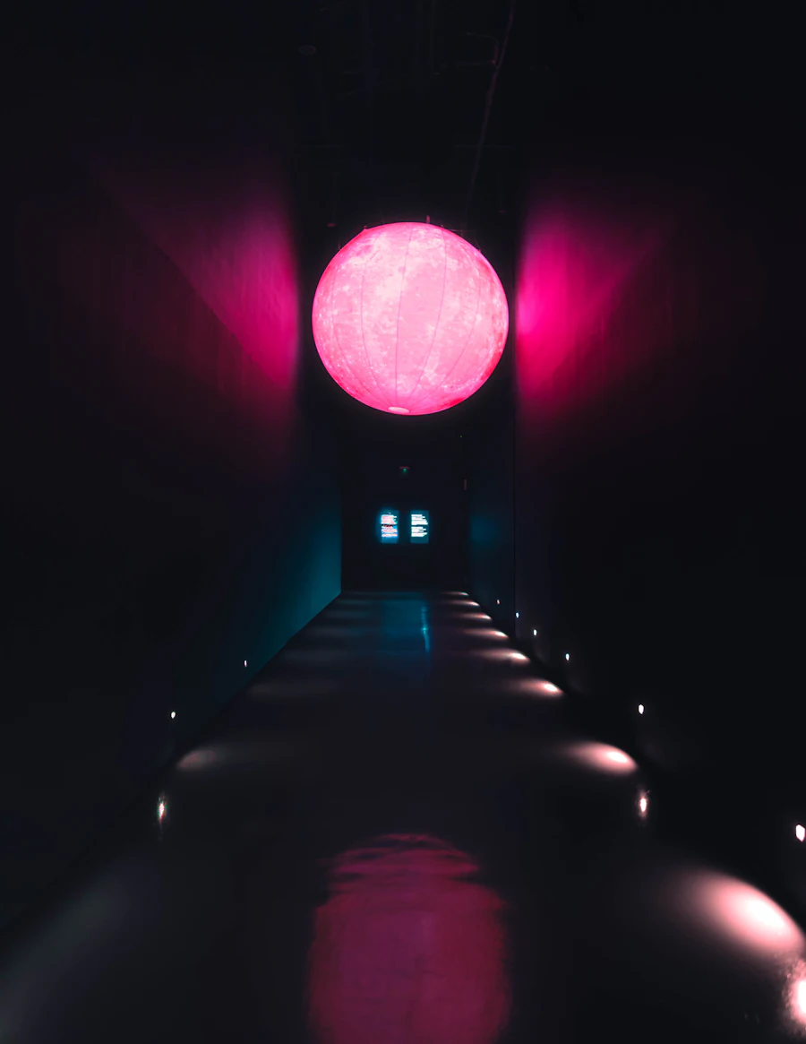 Glowing sphere suspended in a dark corridor