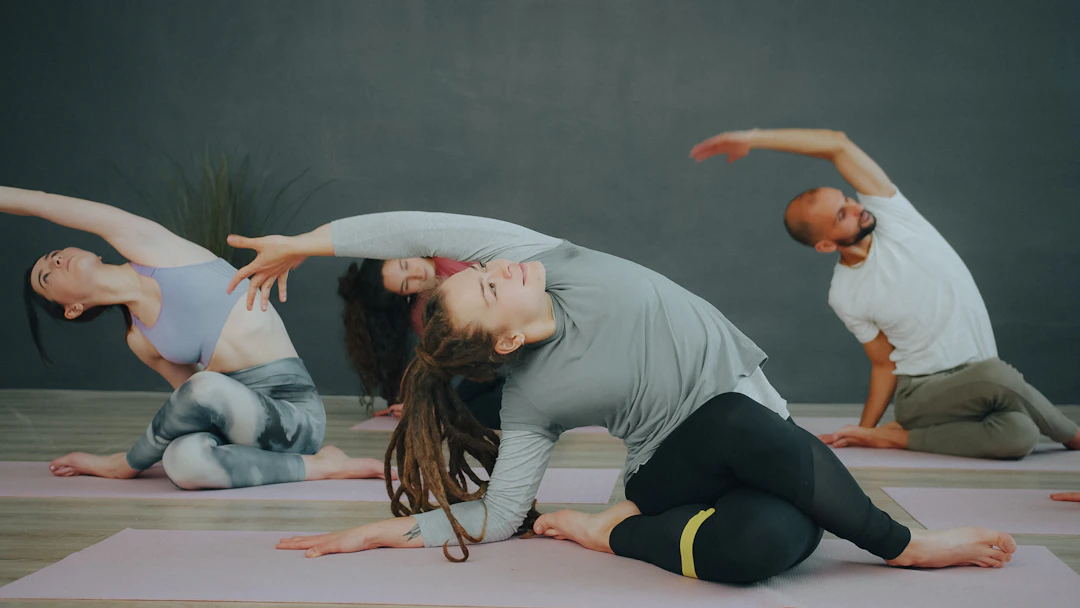 People stretching on yoga mats