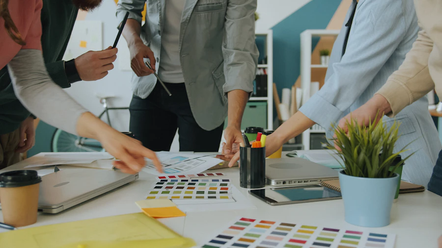 A team arranging colour samples and design materials