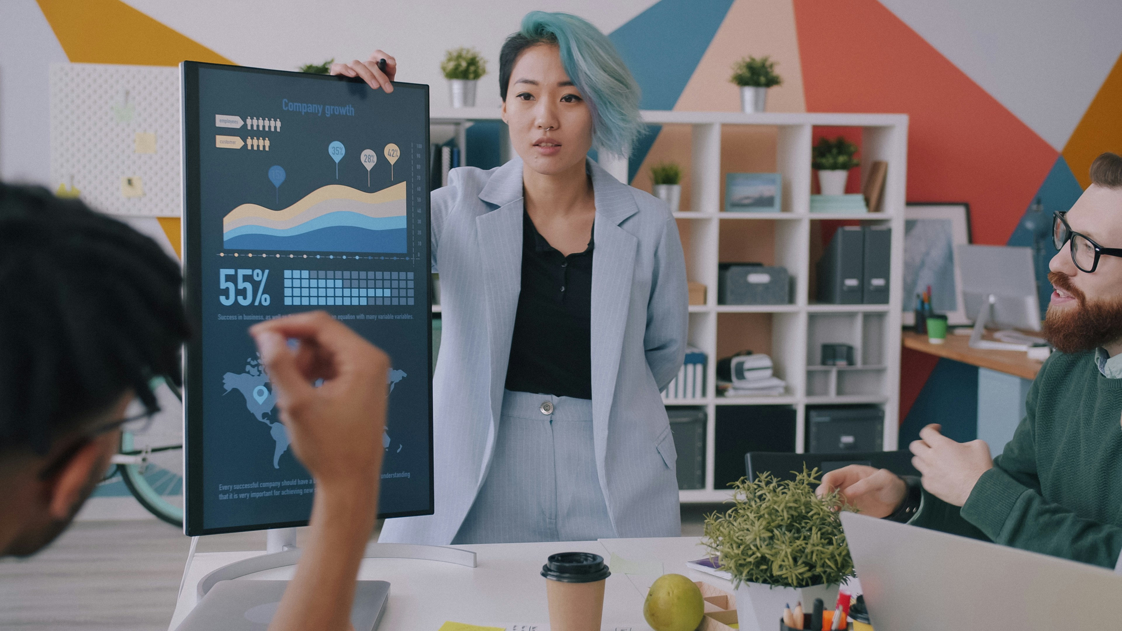 data analyst presenting work trial project in office