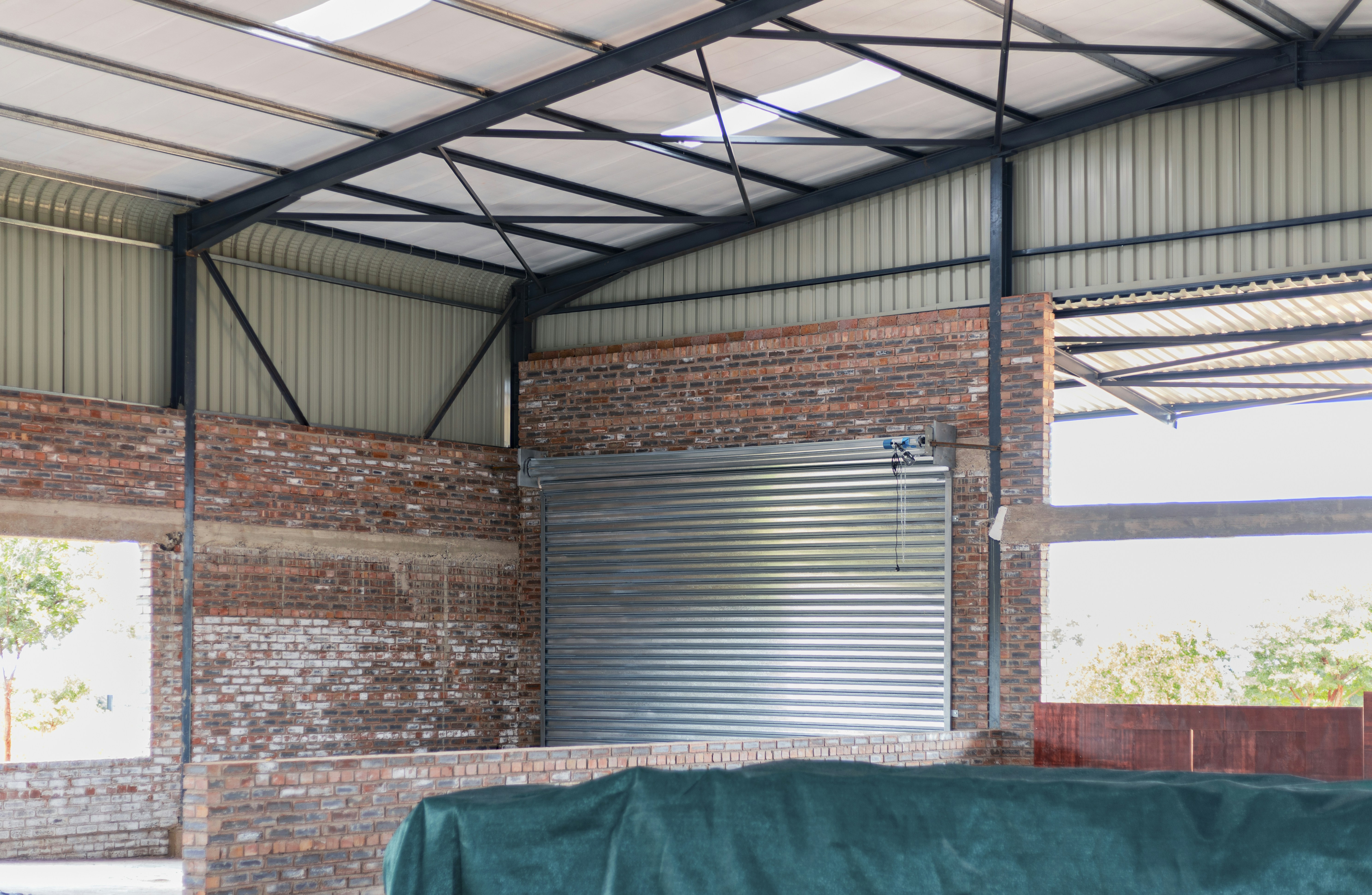 Metal roll-up door in a brick wall