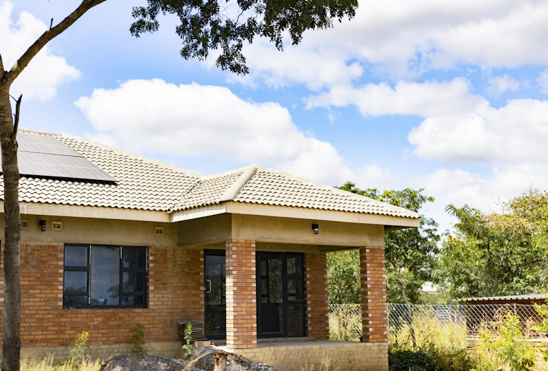 Completed brick house with new windows and veranda