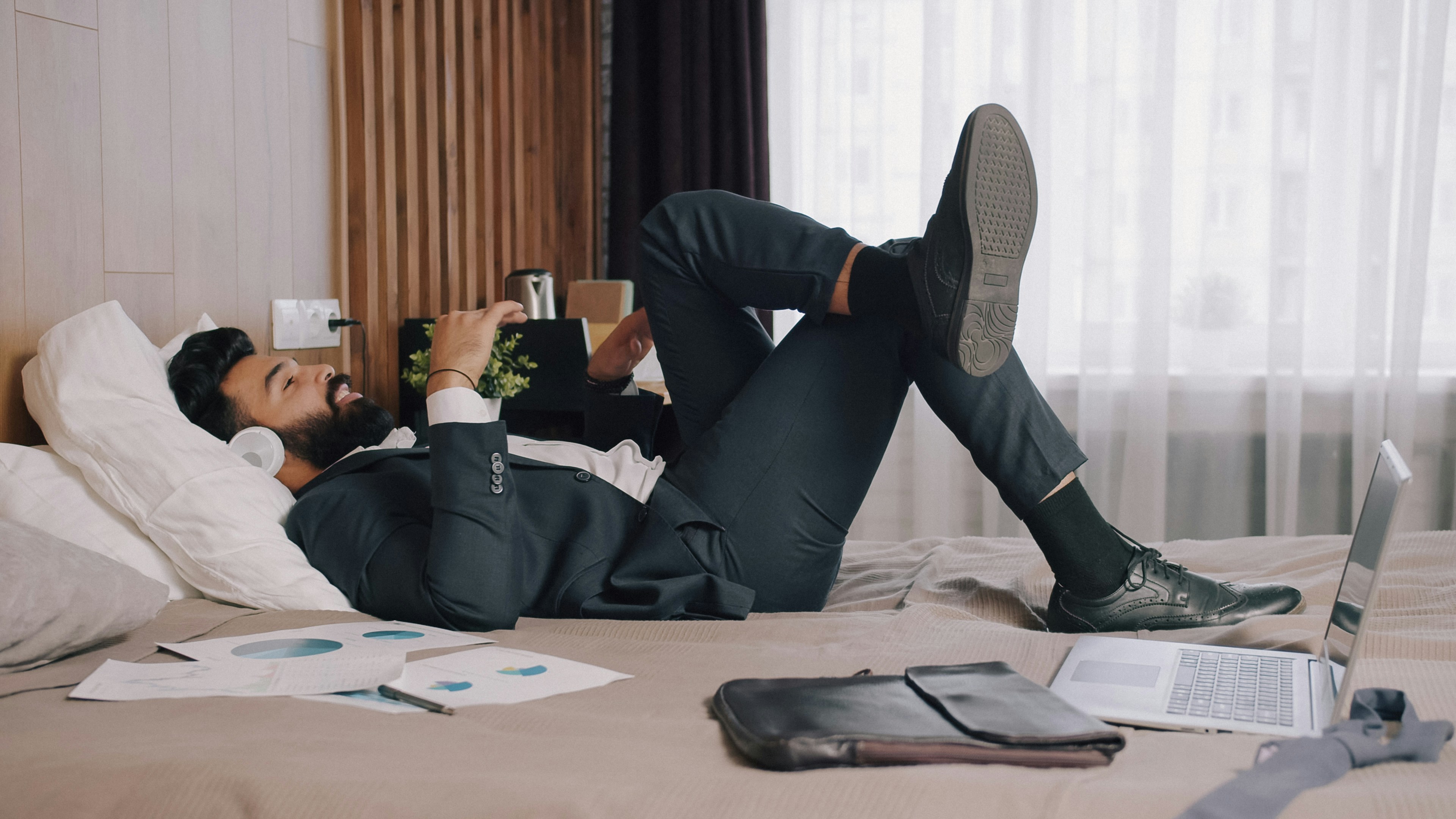 Business traveler relaxing in a modern hotel lounge
