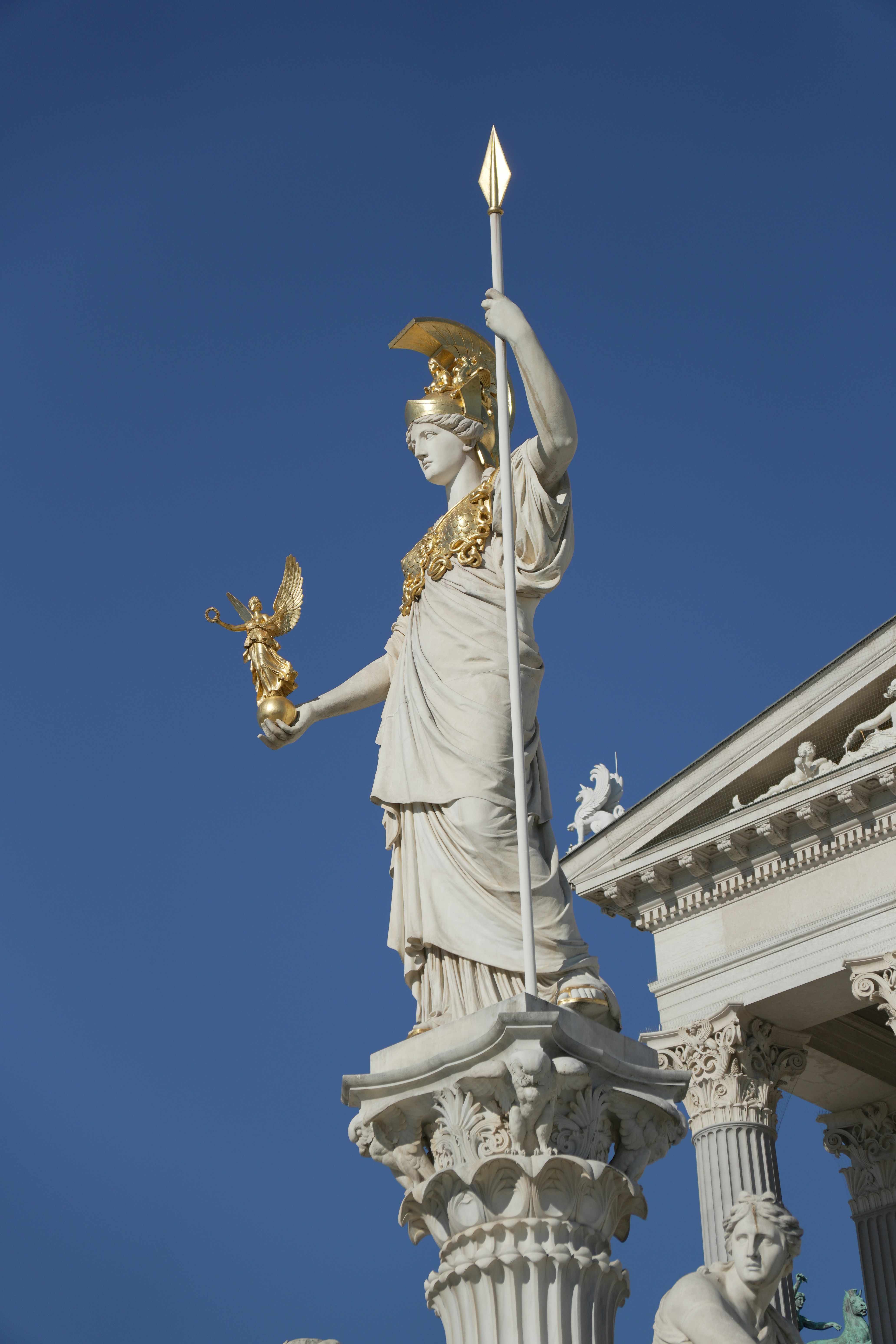 The Pallas Athena statue holding a golden spear and winged figure in Vienna
