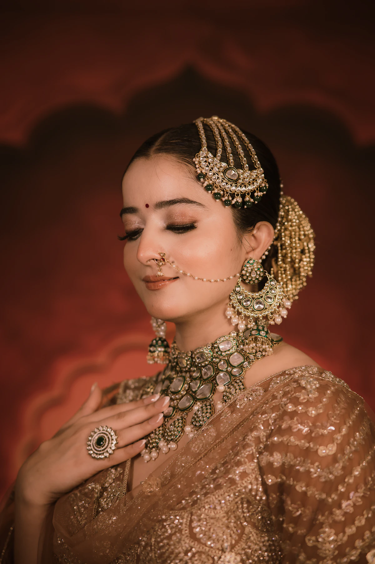 Indian bridal portrait with ornate jewelry and nose ring
