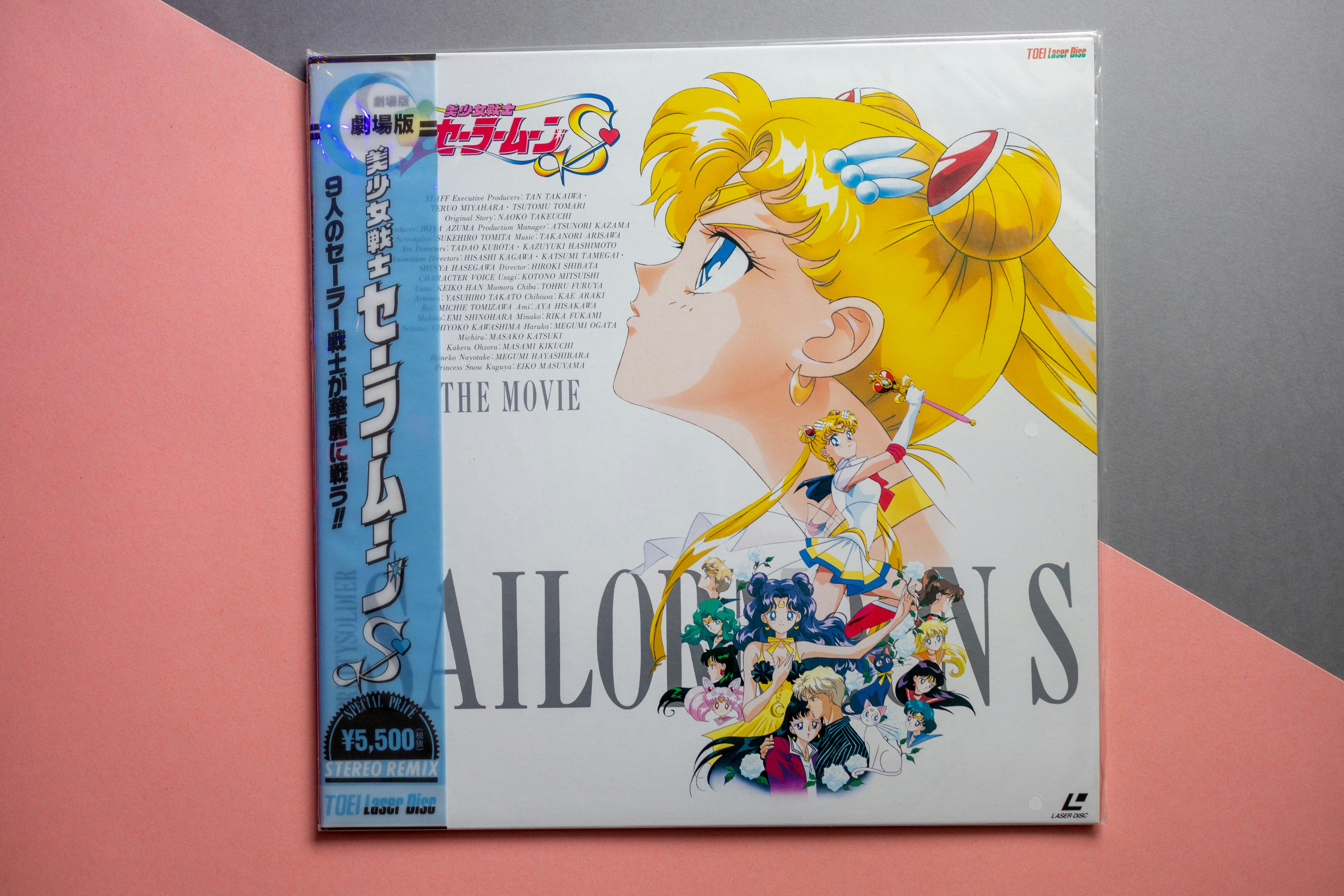 sailor moon wallpaper - A Sailor Moon S movie laserdisc cover with anime characters on a pink background