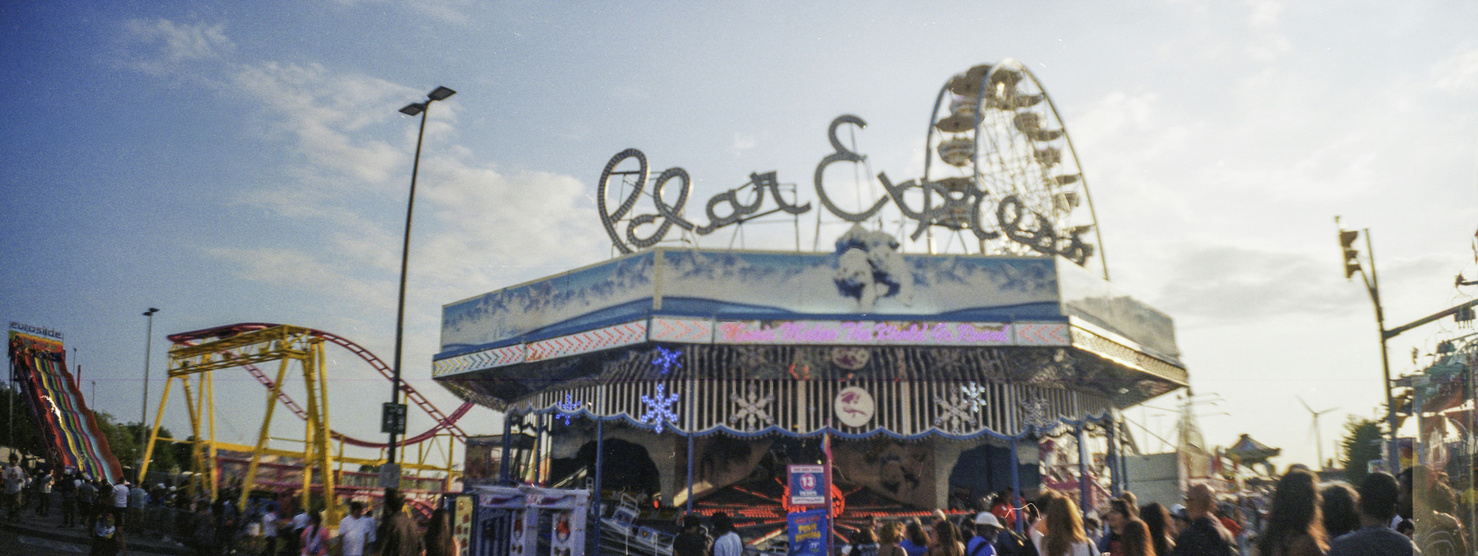 A carnival ride named Polar Express with a ferris wheel in the background