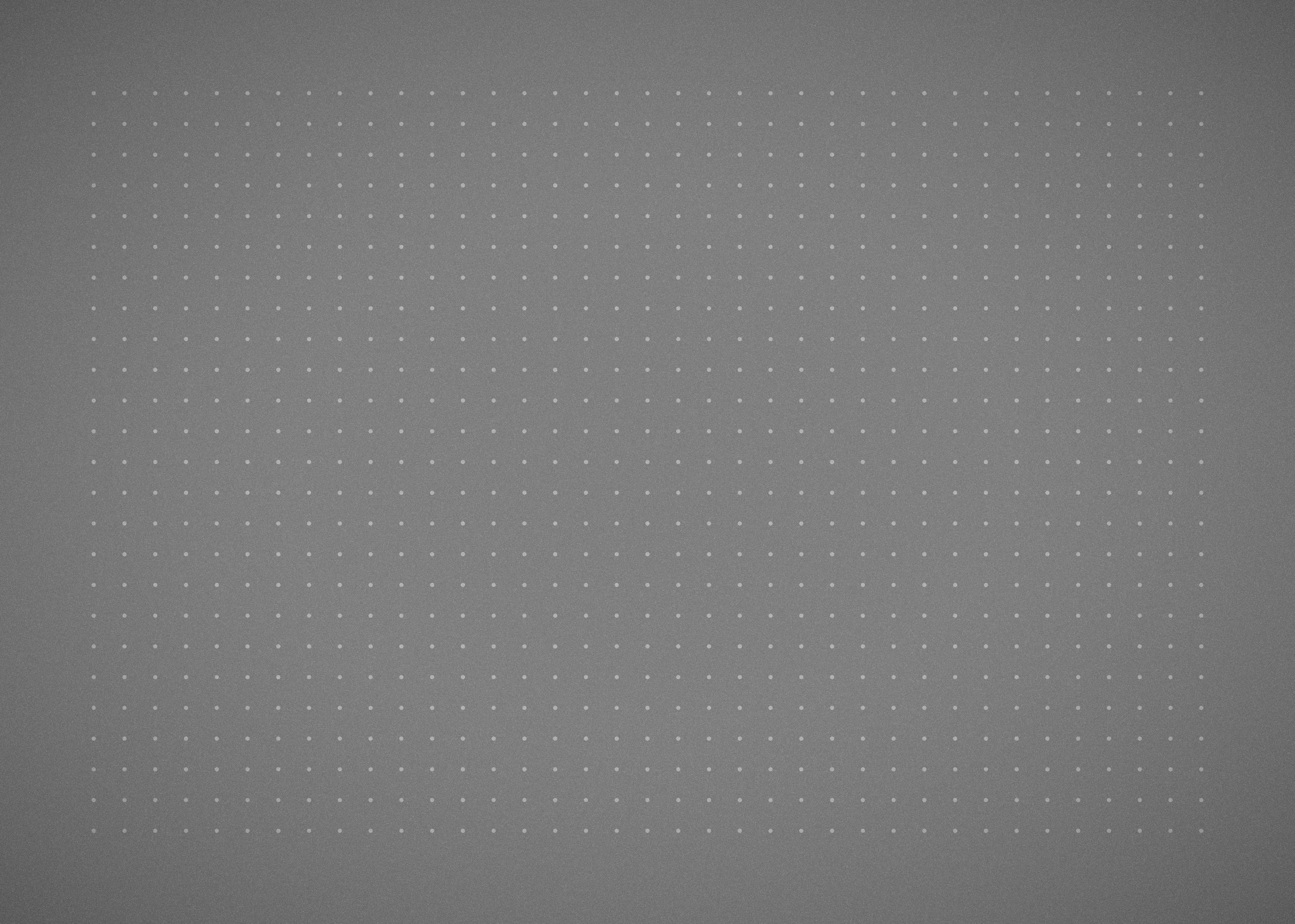 A grid of small white dots on a solid grey background