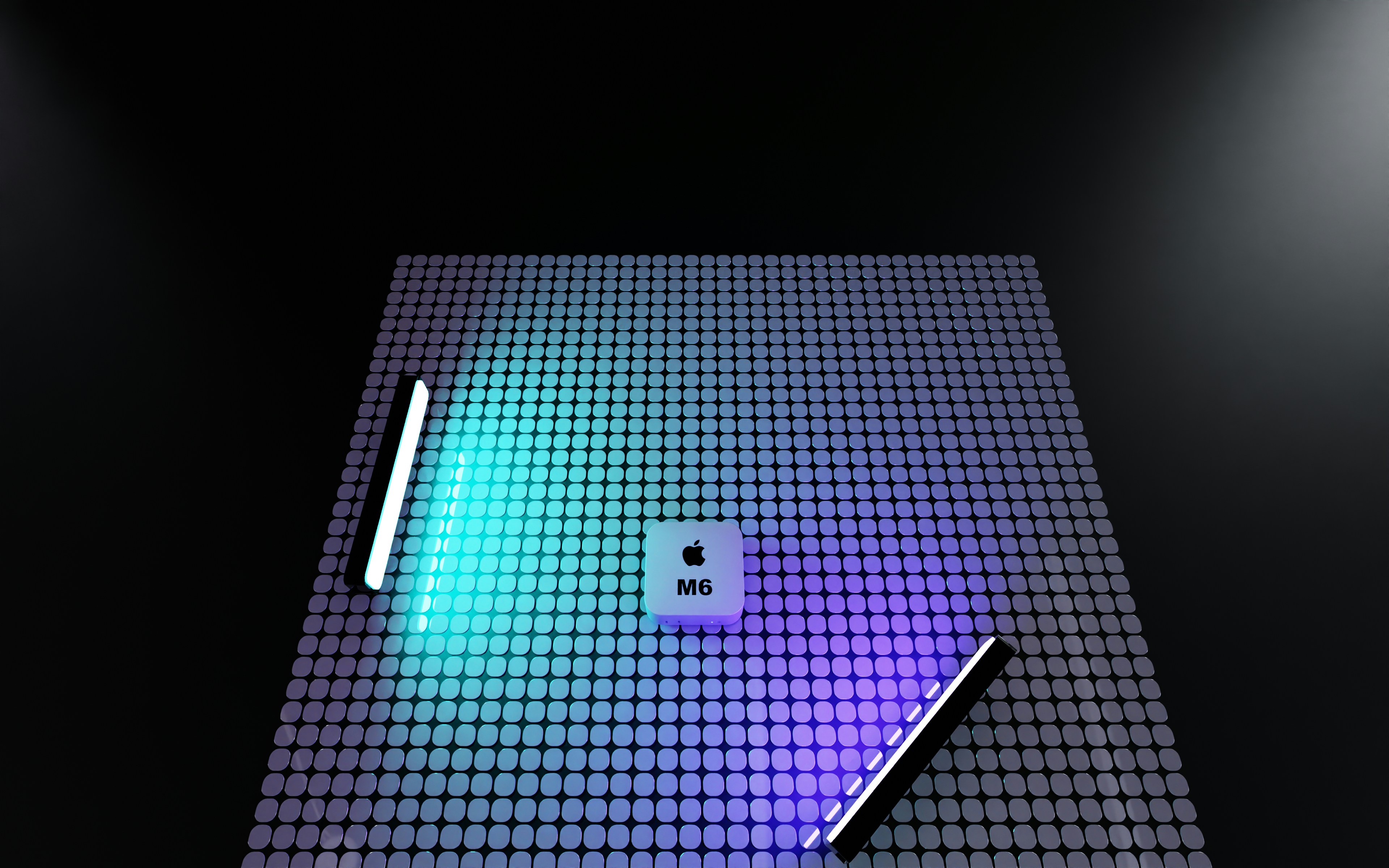 A square white device with an Apple logo and M6 text on a grid